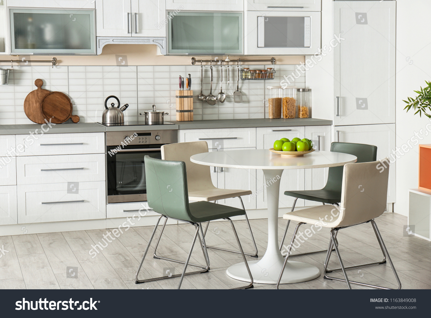 Stock Photo Stylish Kitchen Interior With Dining Table And Chairs 1163849008 