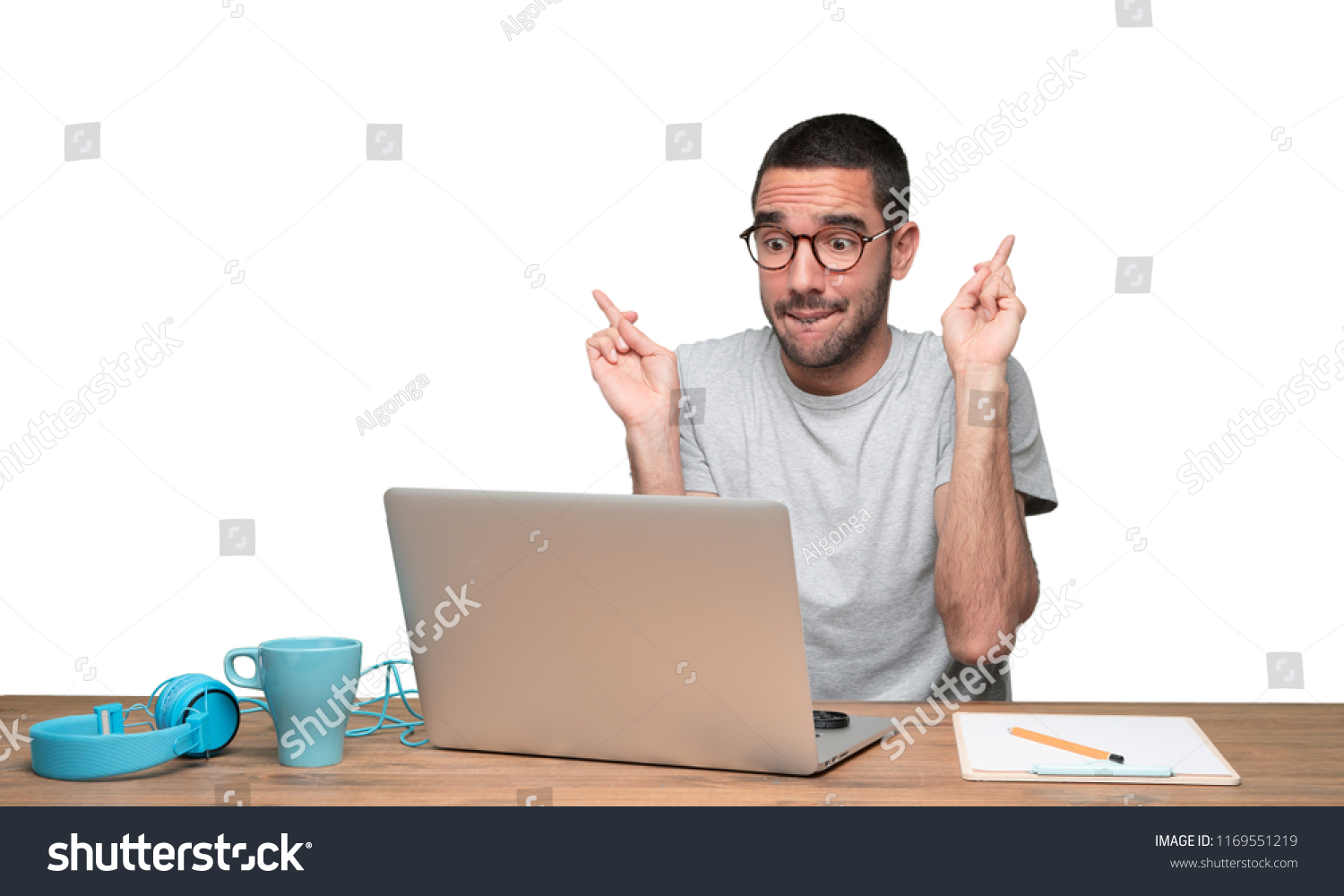 Concept Young Man Sitting His Desk Stock Photo 1169551219 Shutterstock   Stock Photo Concept Of A Young Man Sitting At His Desk Gesturing 1169551219 