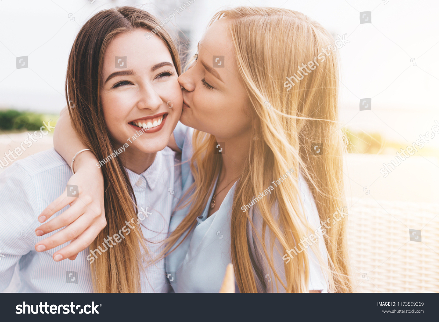 A Girl And Another Girl Kissing