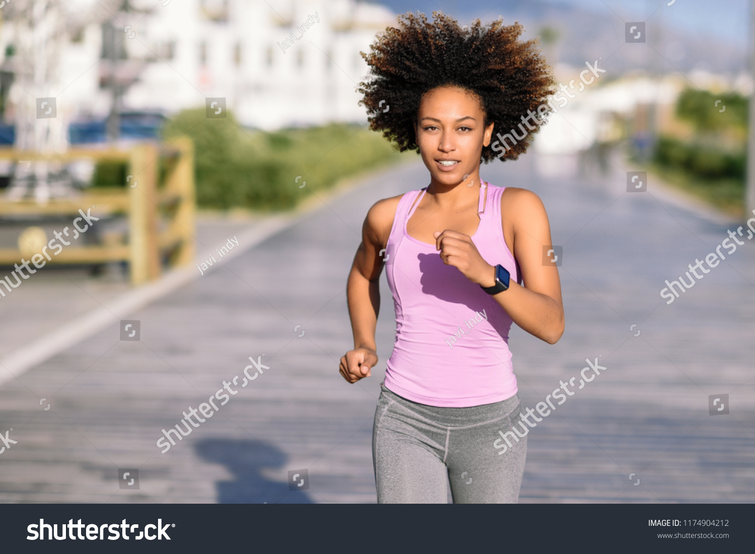 Black Woman Afro Hairstyle Running Outdoors Stock Photo 1174904212 ...