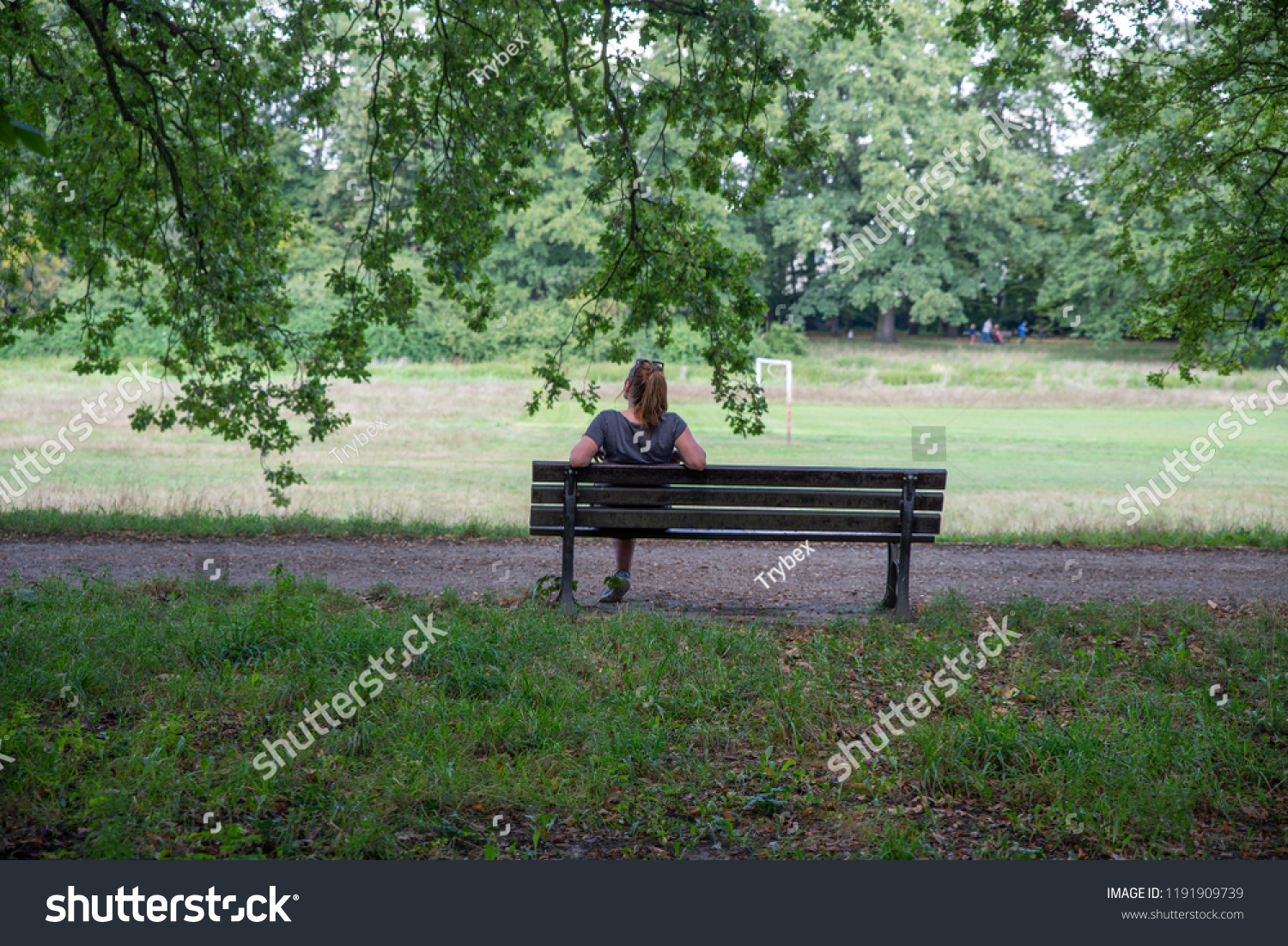 Sad Woman Sitting On Bench Image