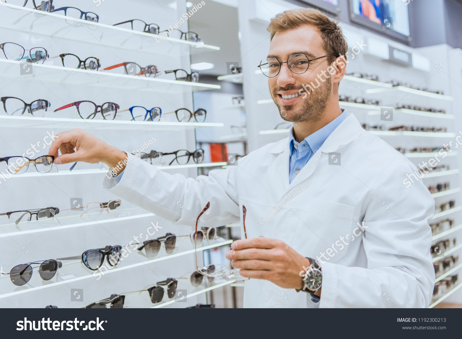 Smiling Optician White Coat Taking Eyesight Stock Photo 1192300213 ...