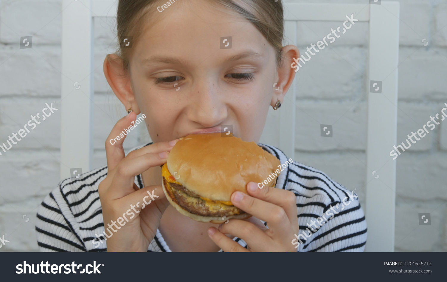 Child Eating Hamburger Restaurant Kid Eats Stock Photo 1201626712 ...