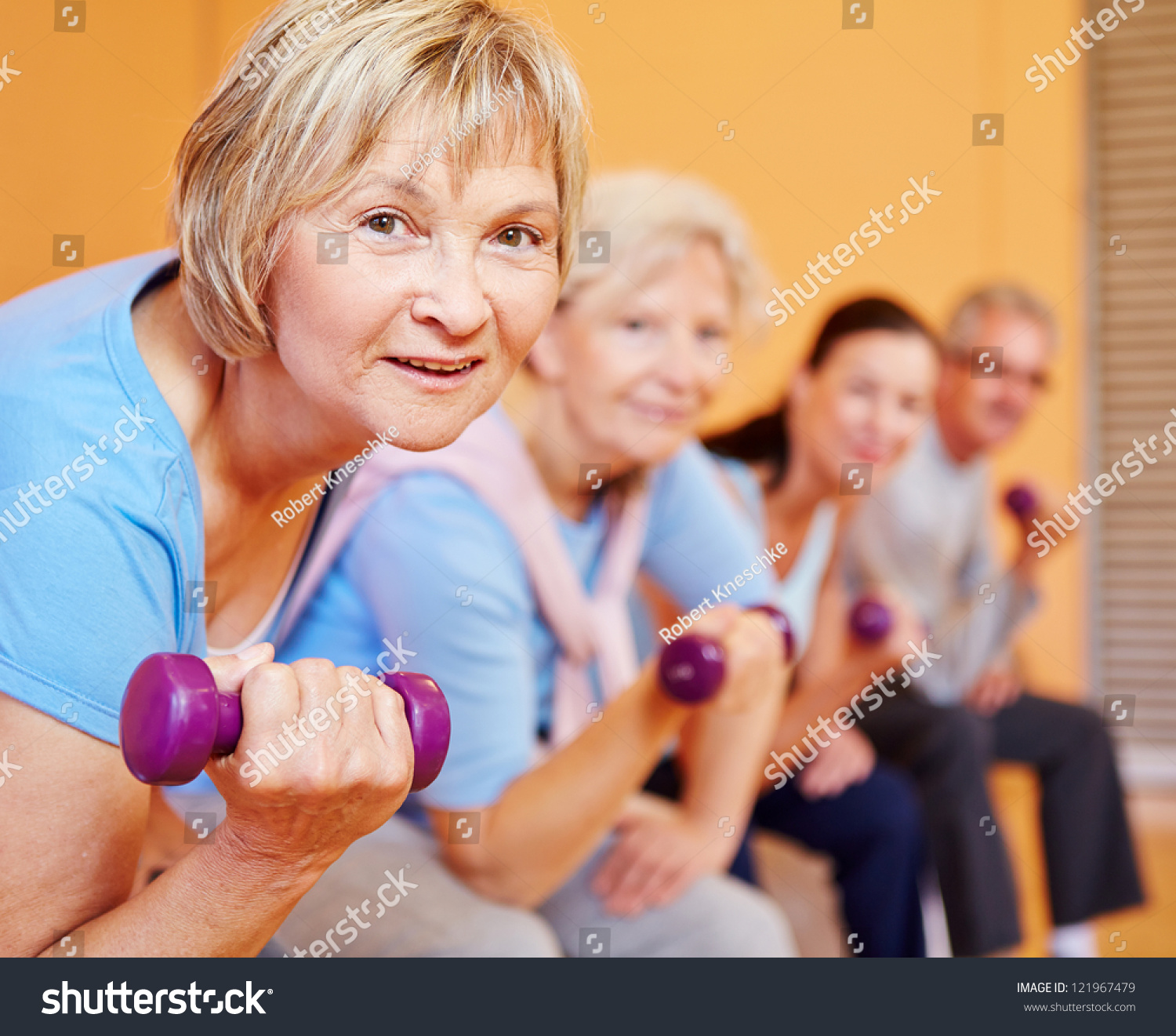 Senior Woman Dumbbells Doing Back Training Stock Photo 121967479