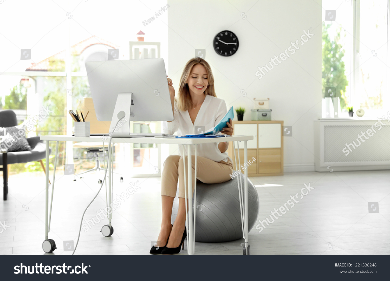 3 111 Exercise Ball Office Images Stock Photos Vectors Shutterstock   Stock Photo Happy Young Businesswoman Sitting On Fitness Ball At Desk In Office Workplace Exercises 1221338248 