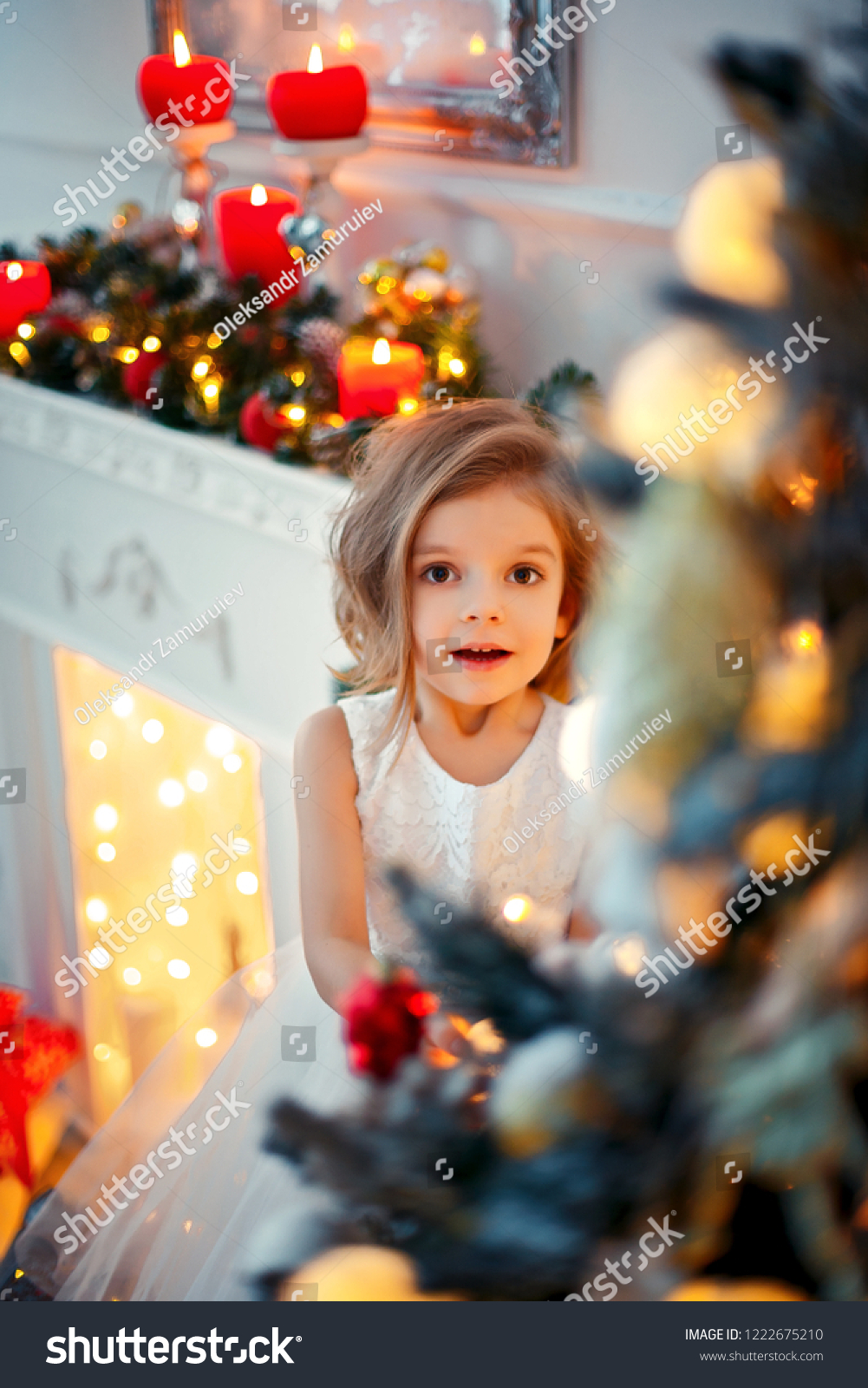 Smiling Little Girl Peeping Behind Christmas Stock Photo 1222675210 ...