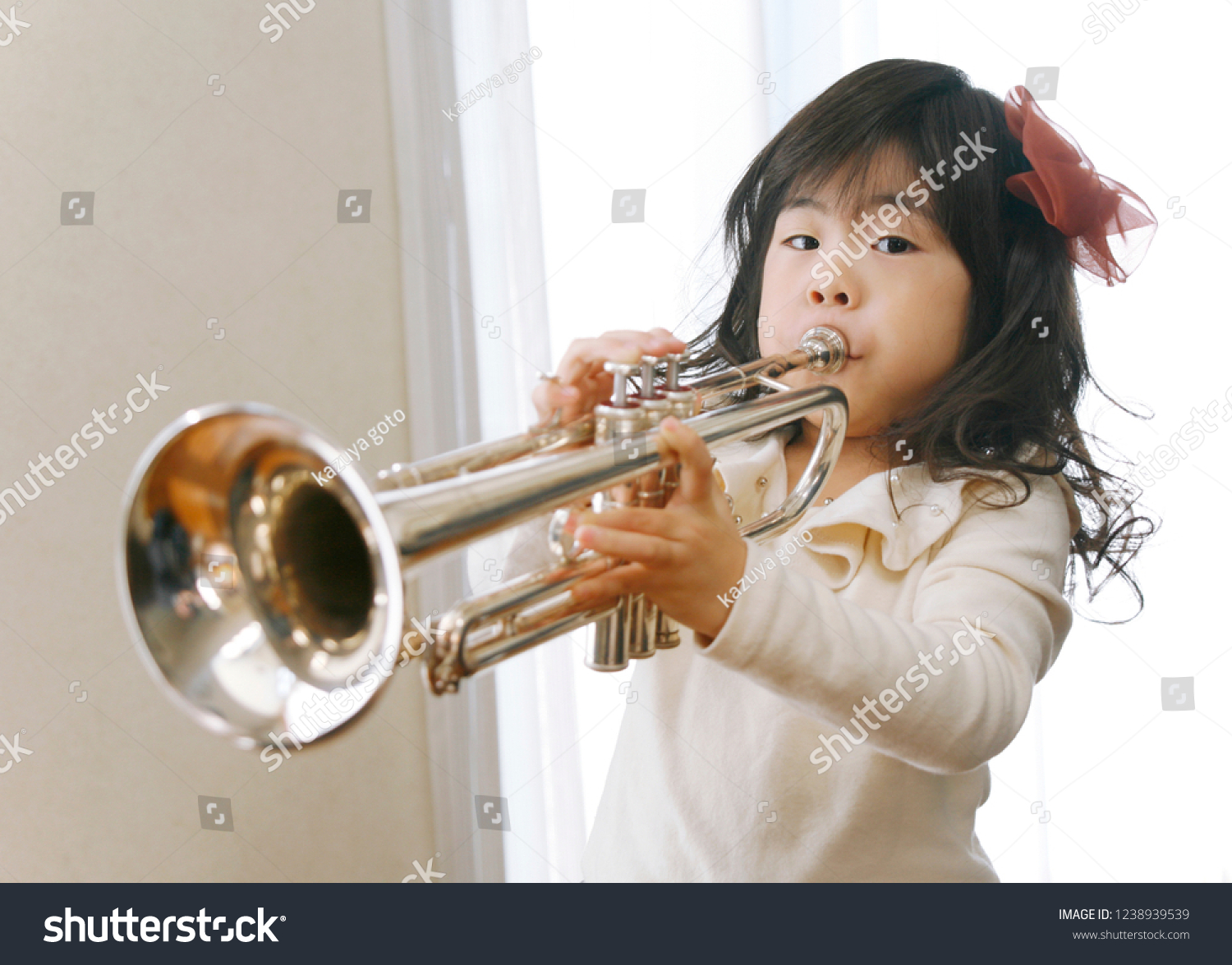 japanese-girl-who-plays-trumpet-stock-photo-1238939539-shutterstock