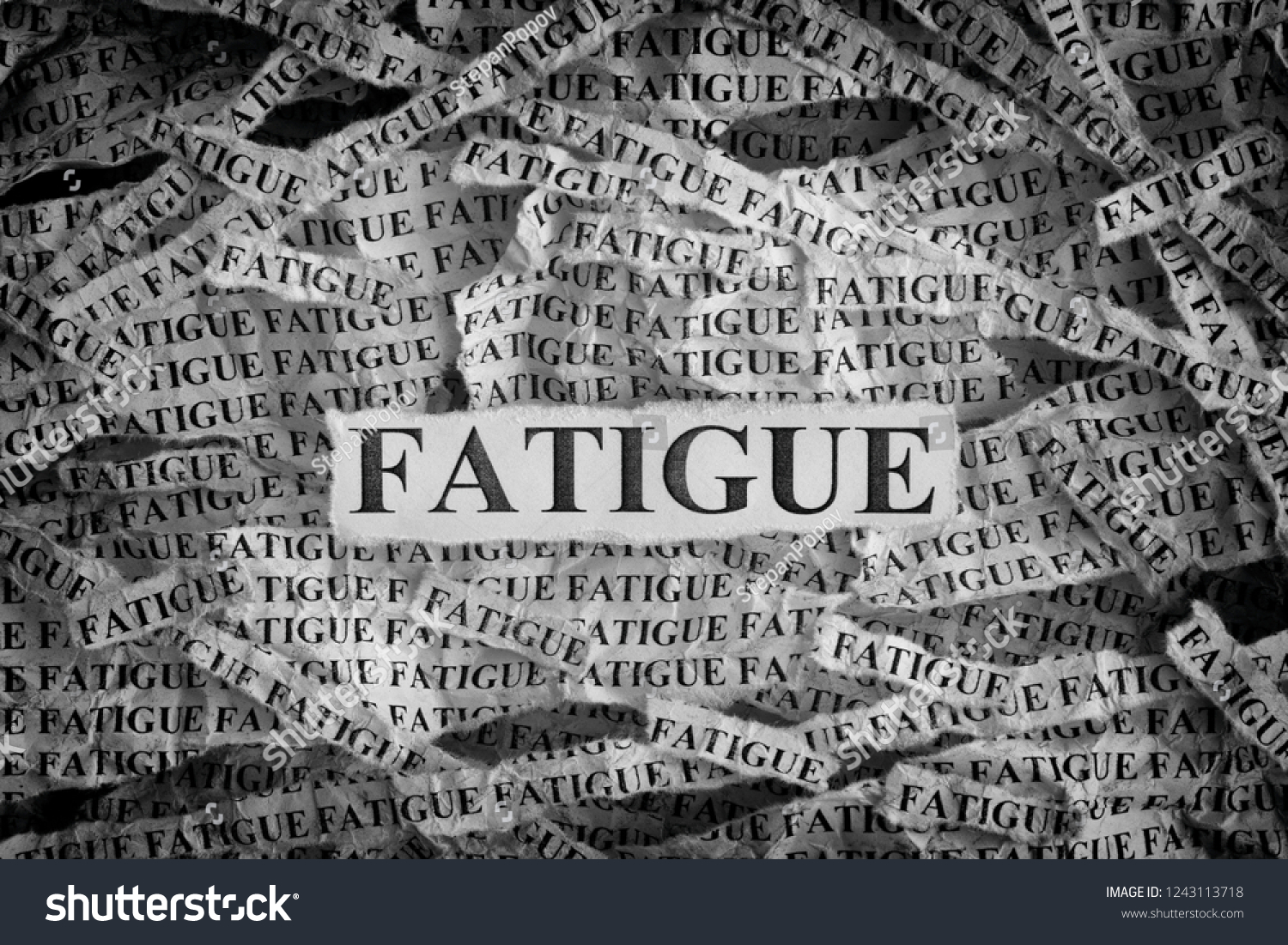 hand-turns-dice-and-changes-the-word-fatigue-to-fatless-stock-photo