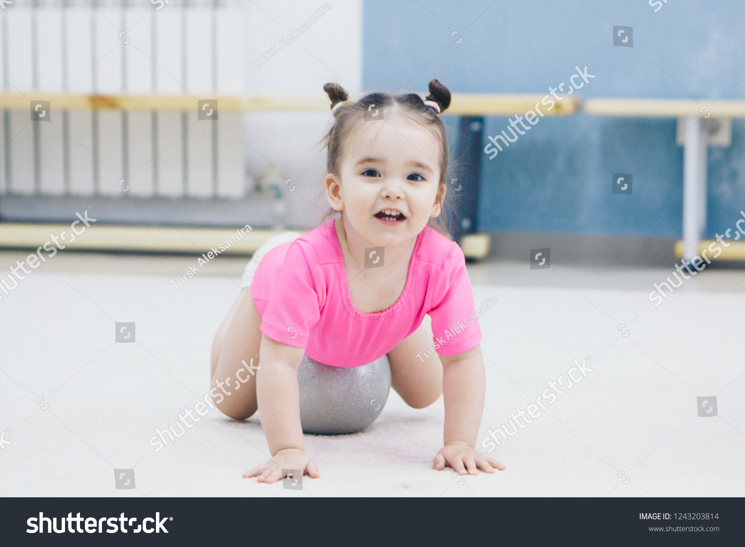 Little Girl Pink Swimsuit Doing Gymnastics Stock Photo 1243203814 ...