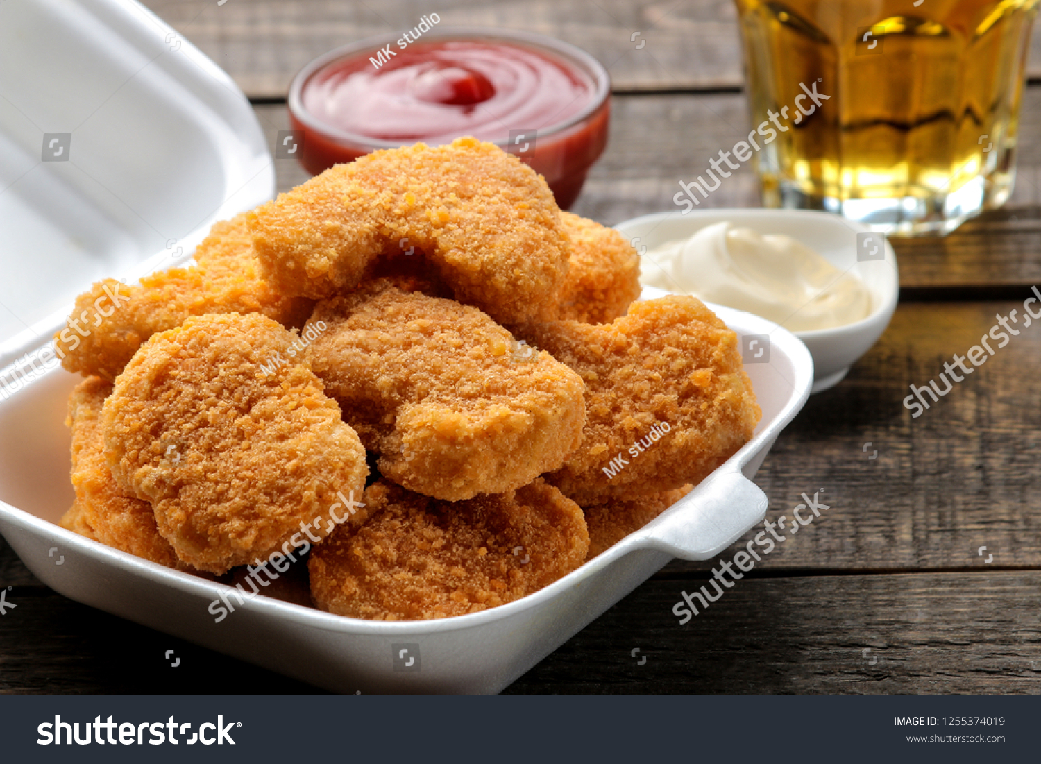 Chicken Nuggets Food Delivery Box White Stock Photo 1255374019   Stock Photo Chicken Nuggets In A Food Delivery Box With White And Red Sauce And Beer On A Brown Wooden 1255374019 