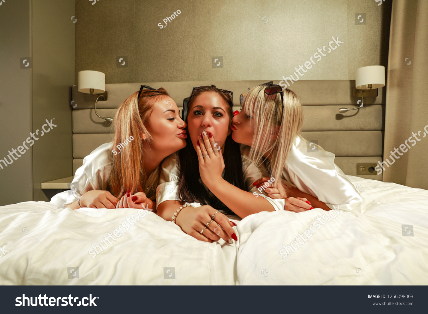 Three Girls Kissing Each Other