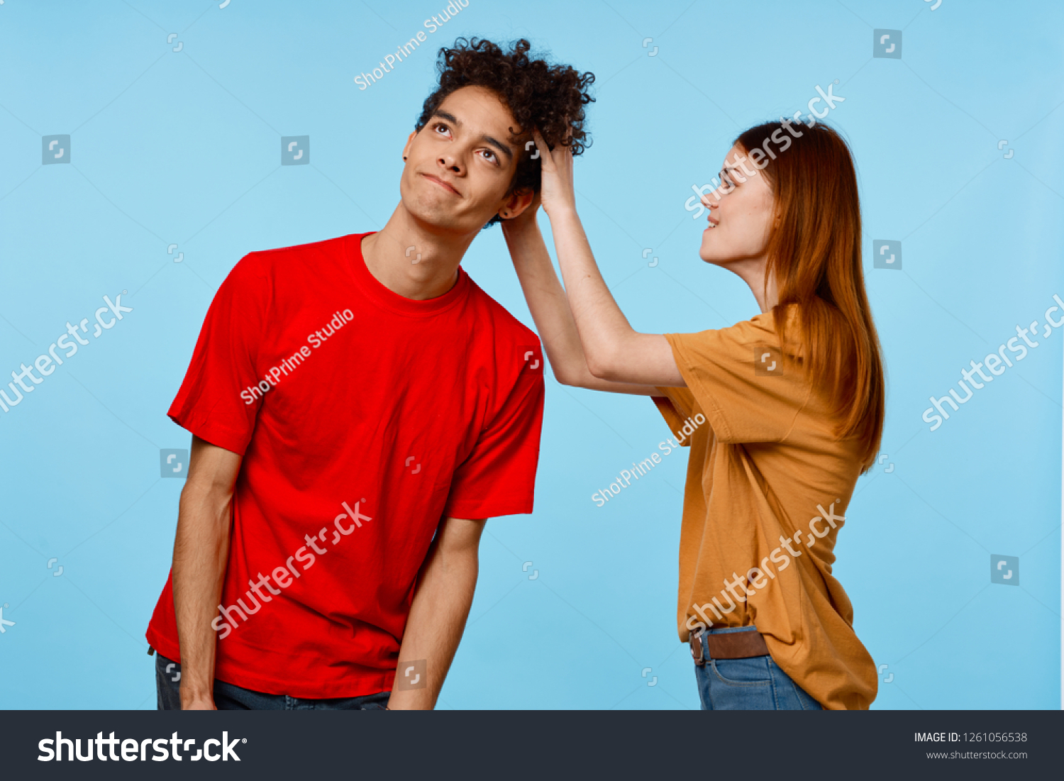 Woman Touches Curly Hair On Mans Stock