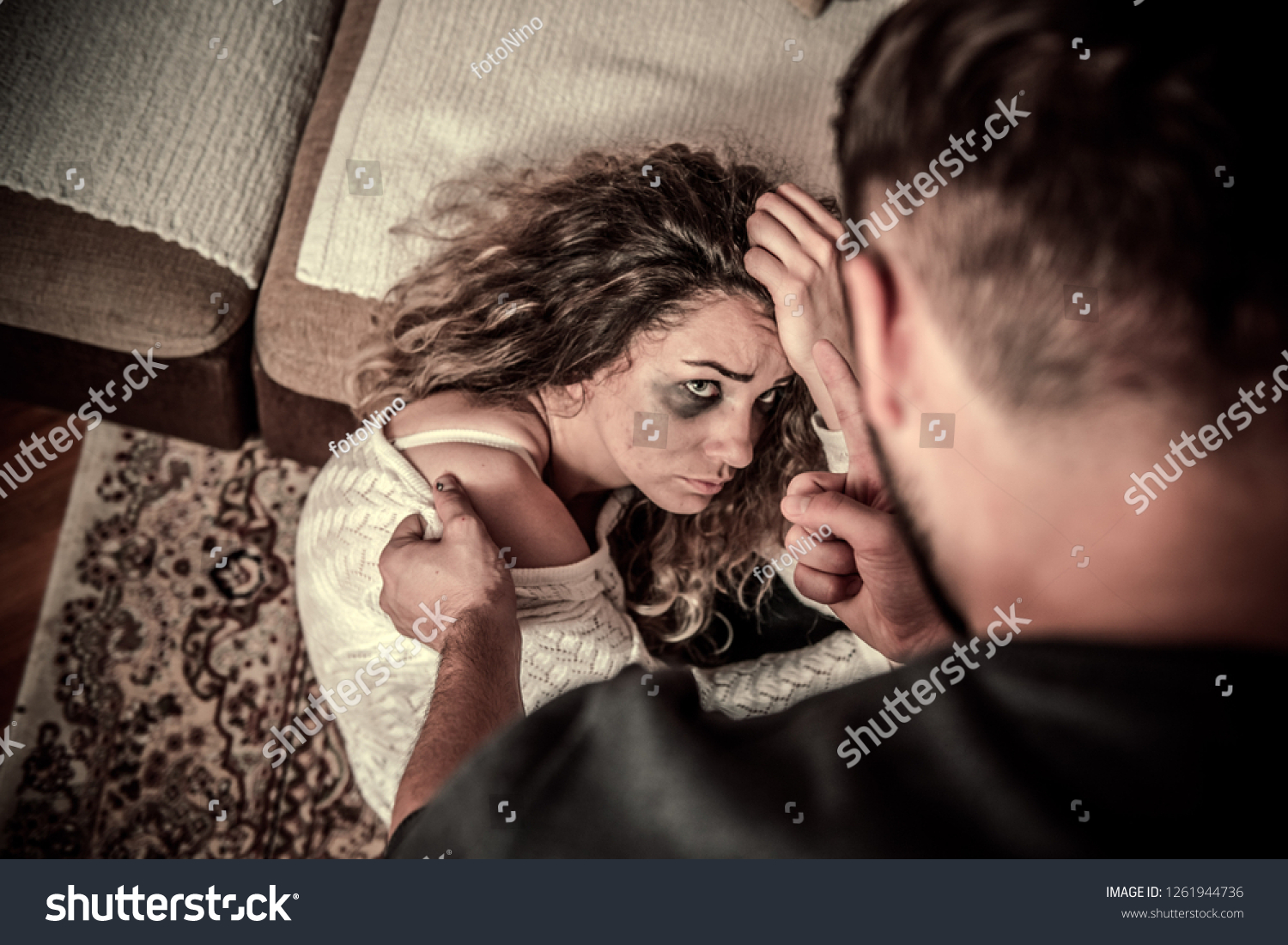 Drunk Man Hitting His Wife Front Stock photo