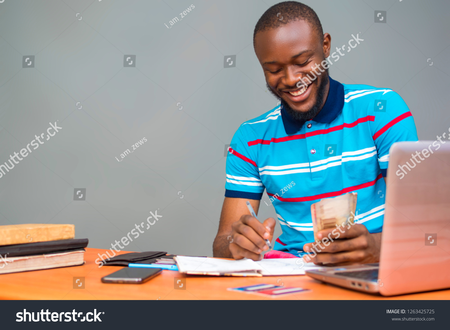 Young Black Man Sitting Desk Smiling Stock Photo 1263425725 | Shutterstock