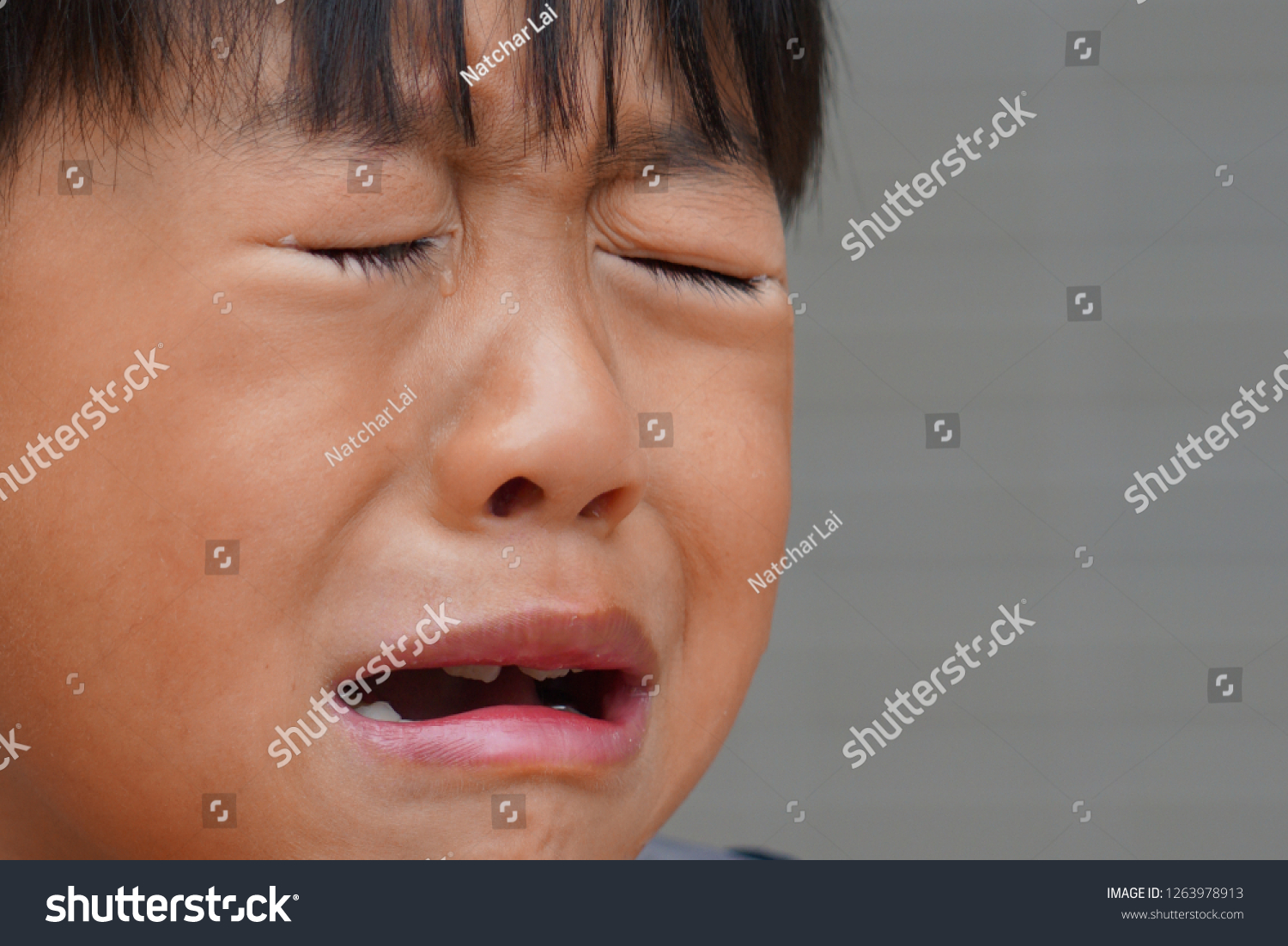 sad-expression-asian-boy-crying-stock-photo-1263978913-shutterstock