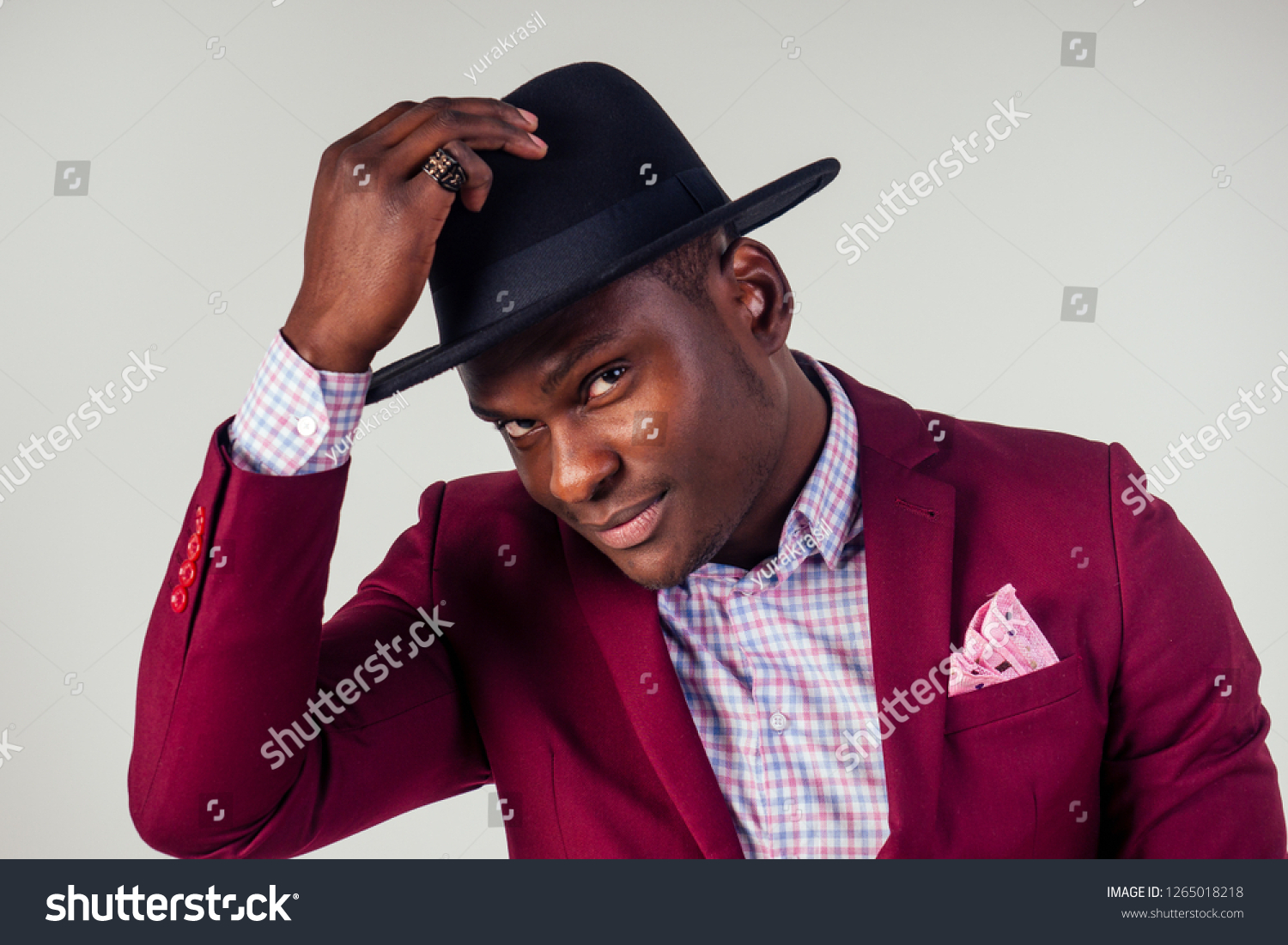 black man in suit and hat