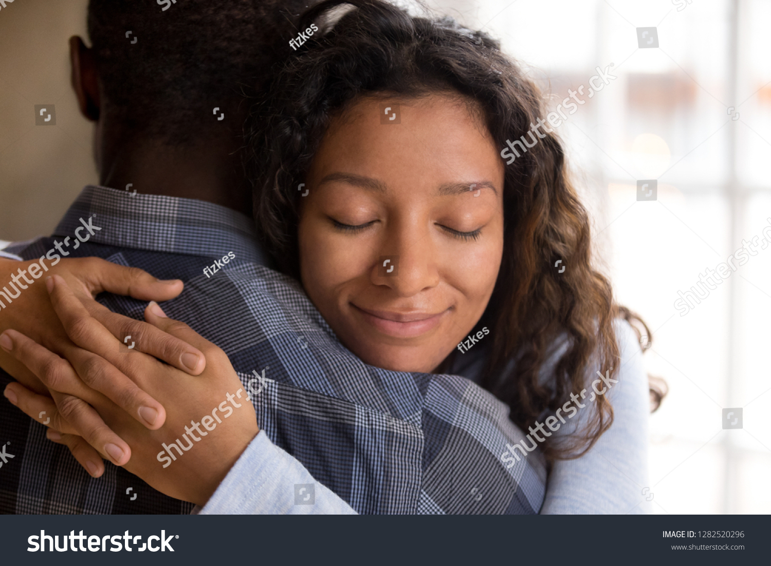 Happy African American Wife Hugging