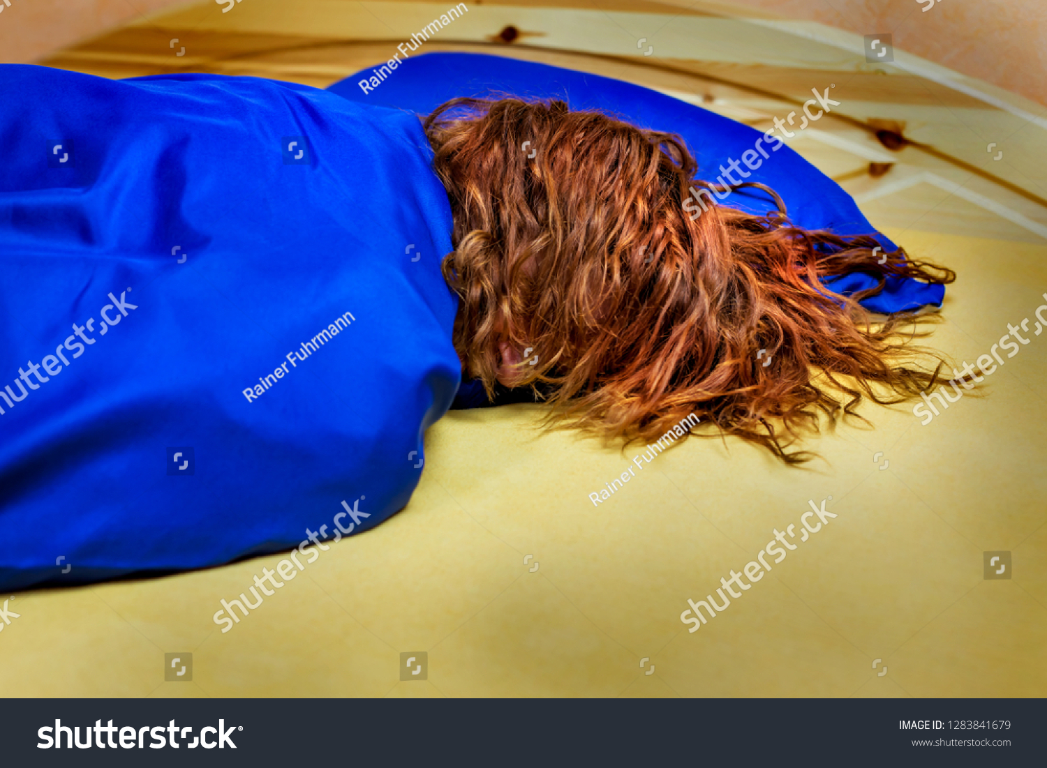 woman-sleeping-bed-stock-photo-1283841679-shutterstock