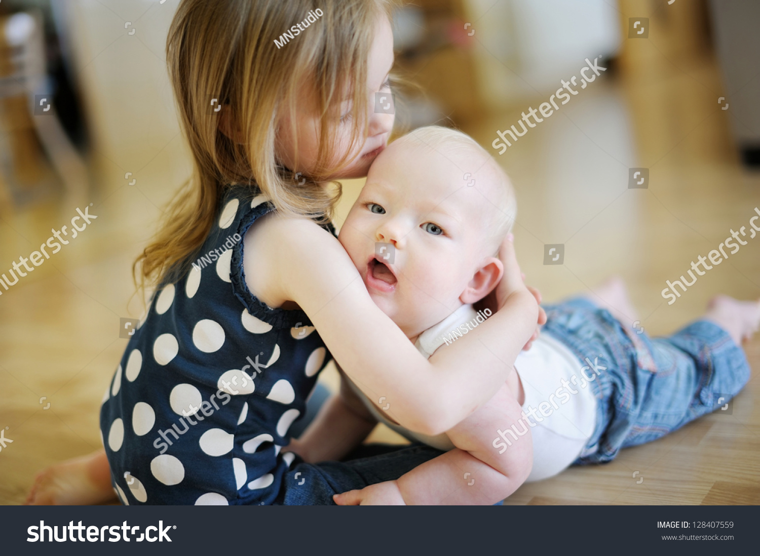 Two Little Sisters Embracing Each Other Stock Photo 128407559 ...