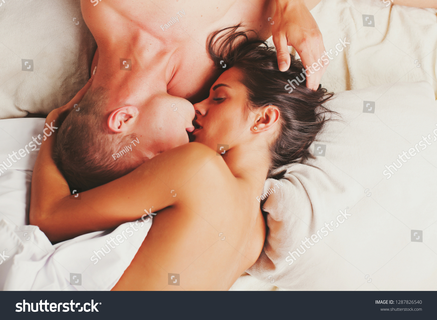 Young Nudist Kissing