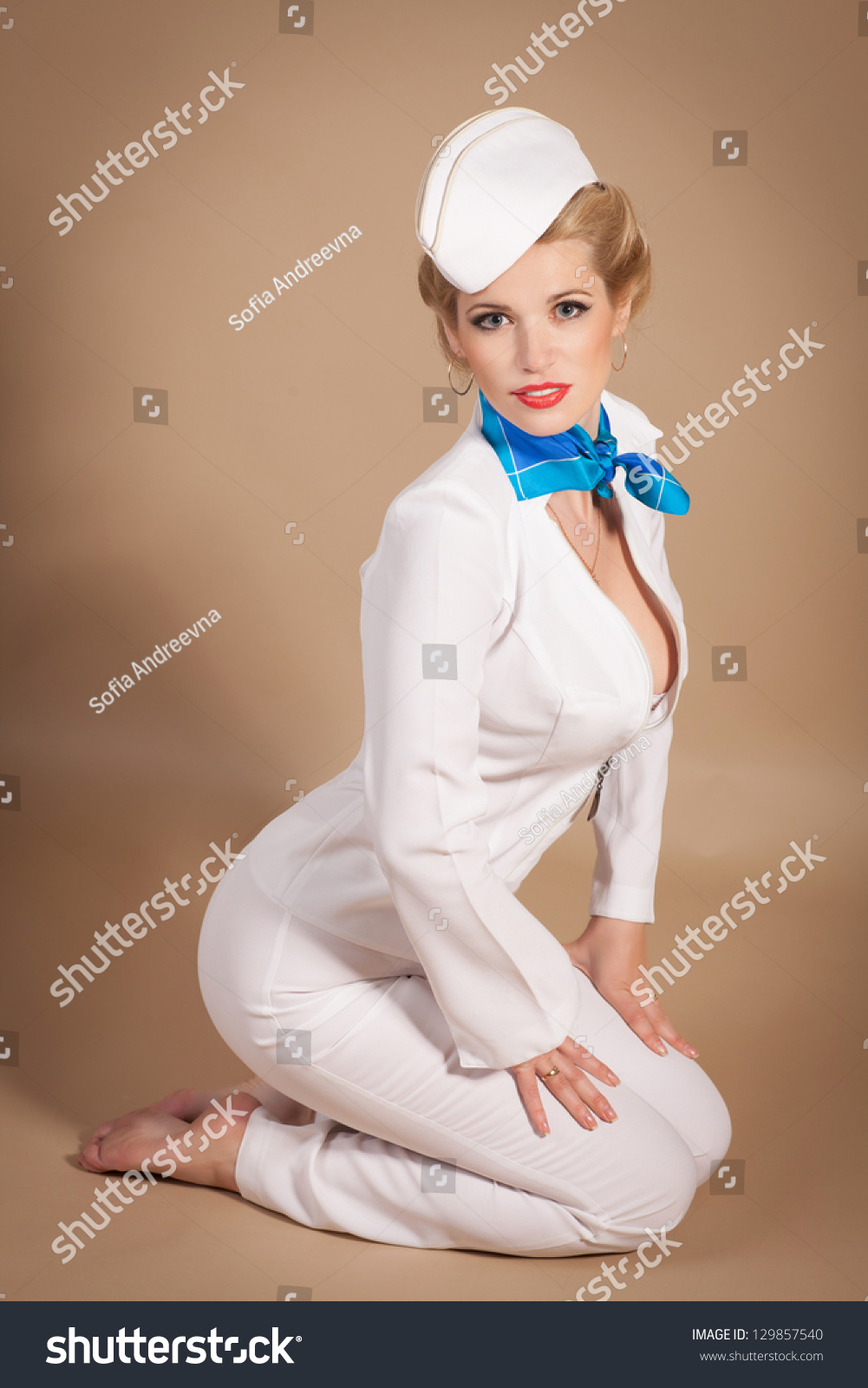 Стоковая фотография 129857540: Beautiful Blonde Woman Stewardess Sailor Mar...