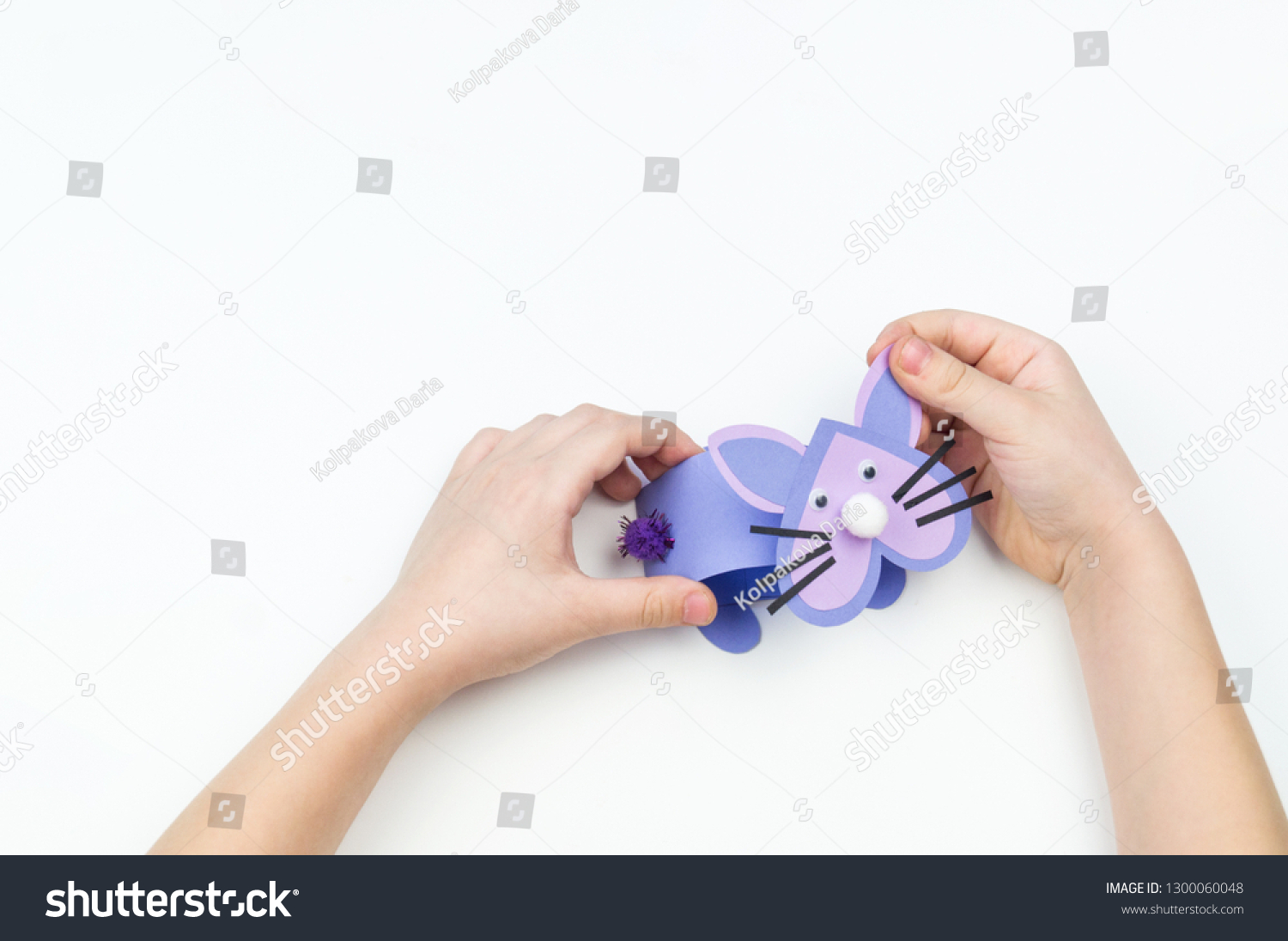 child-makes-easter-bunny-out-paper-stock-photo-1300060048-shutterstock