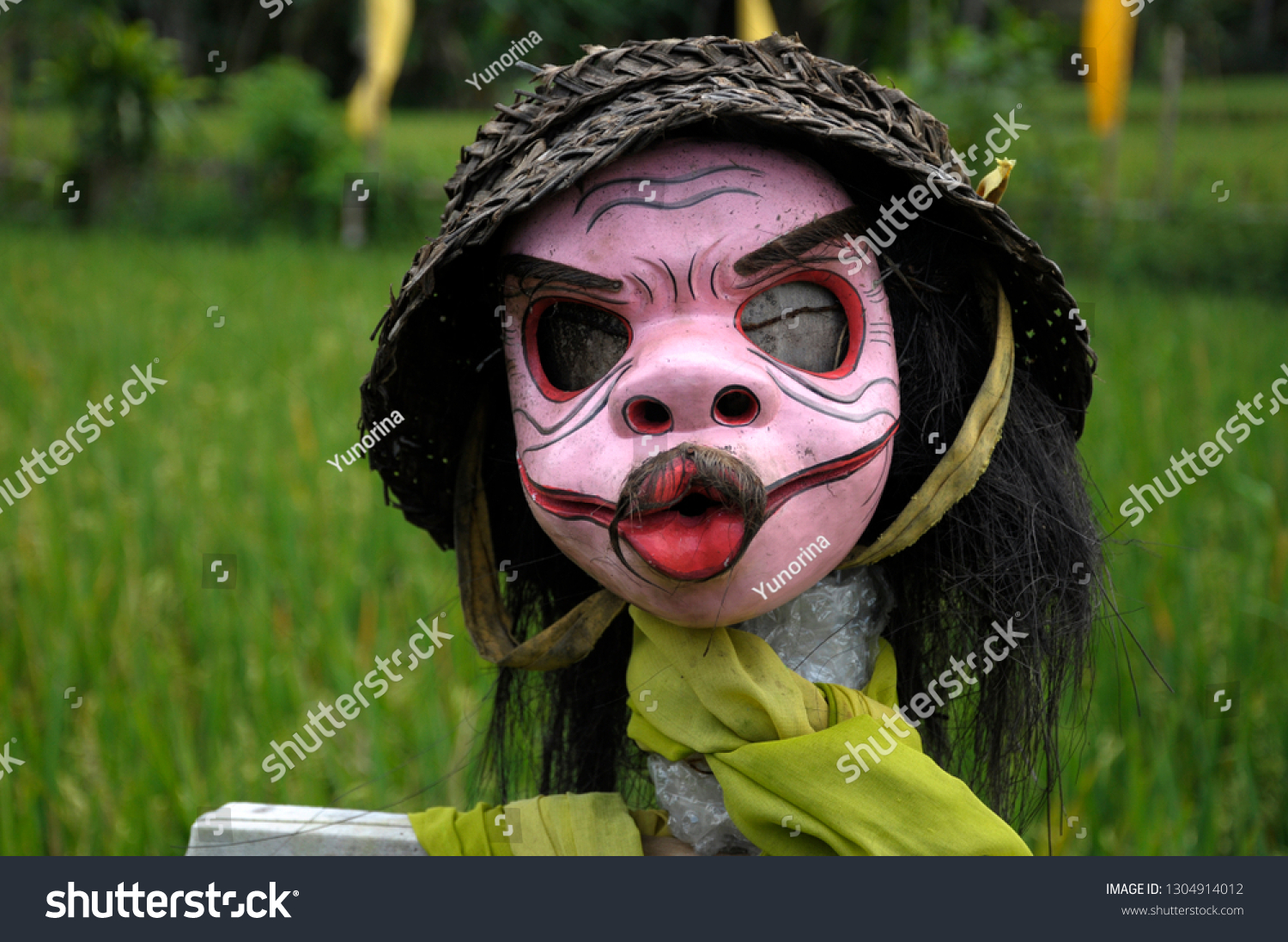 scarecrow with black hat