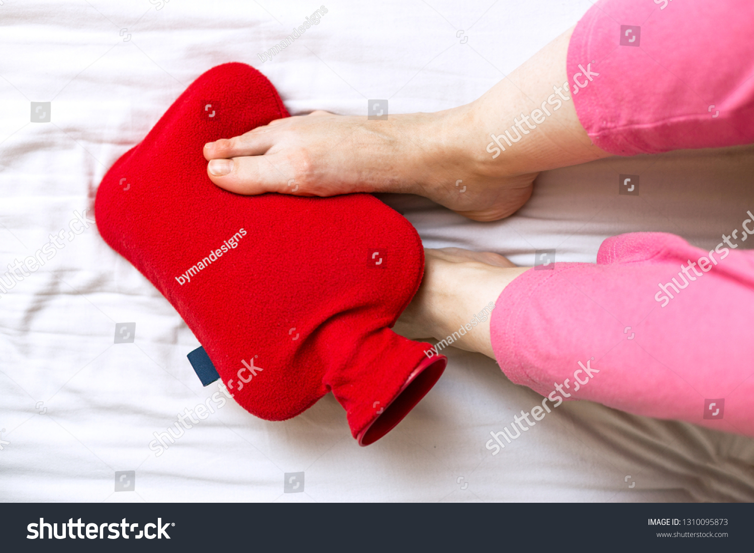 top-view-person-cold-feet-bed-stock-photo-1310095873-shutterstock