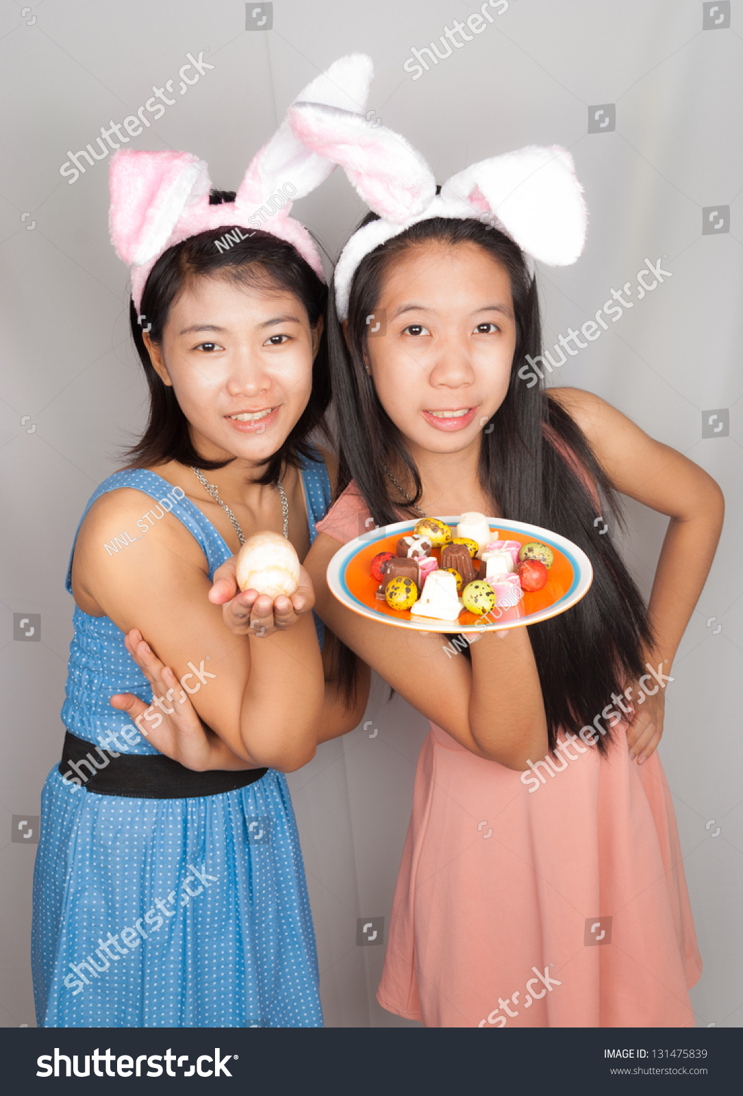 Cute Asian Bunny Girls Hold Plate Stock