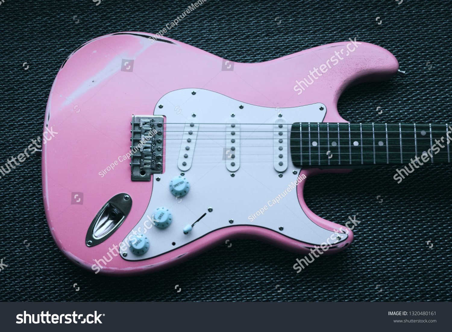 pink and purple electric guitar