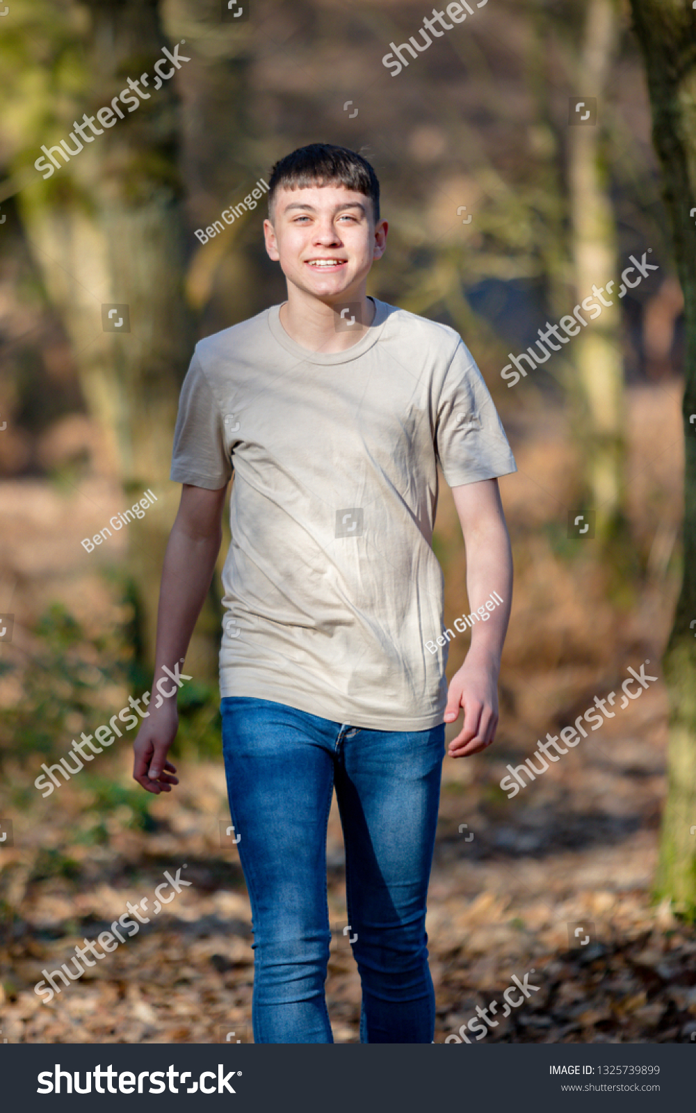 Happy Teenage Caucasian Boy Walking Through Stock Photo 1325739899 ...