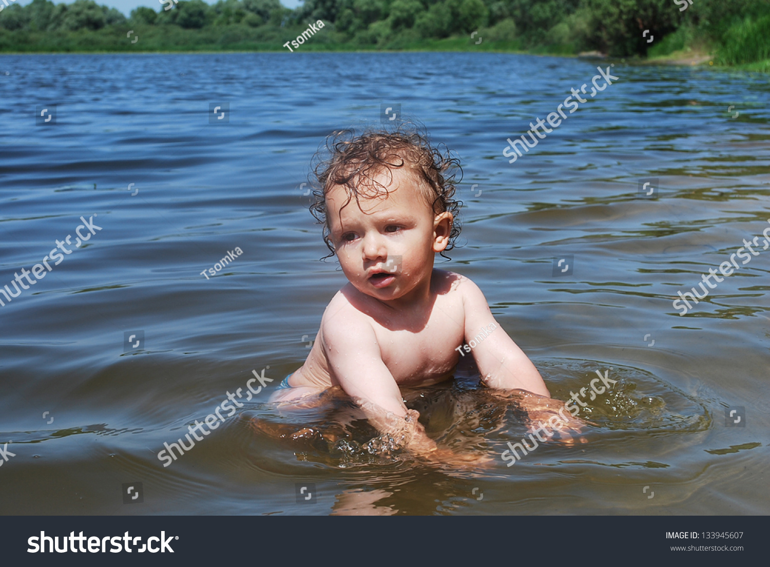 boy swimming in river