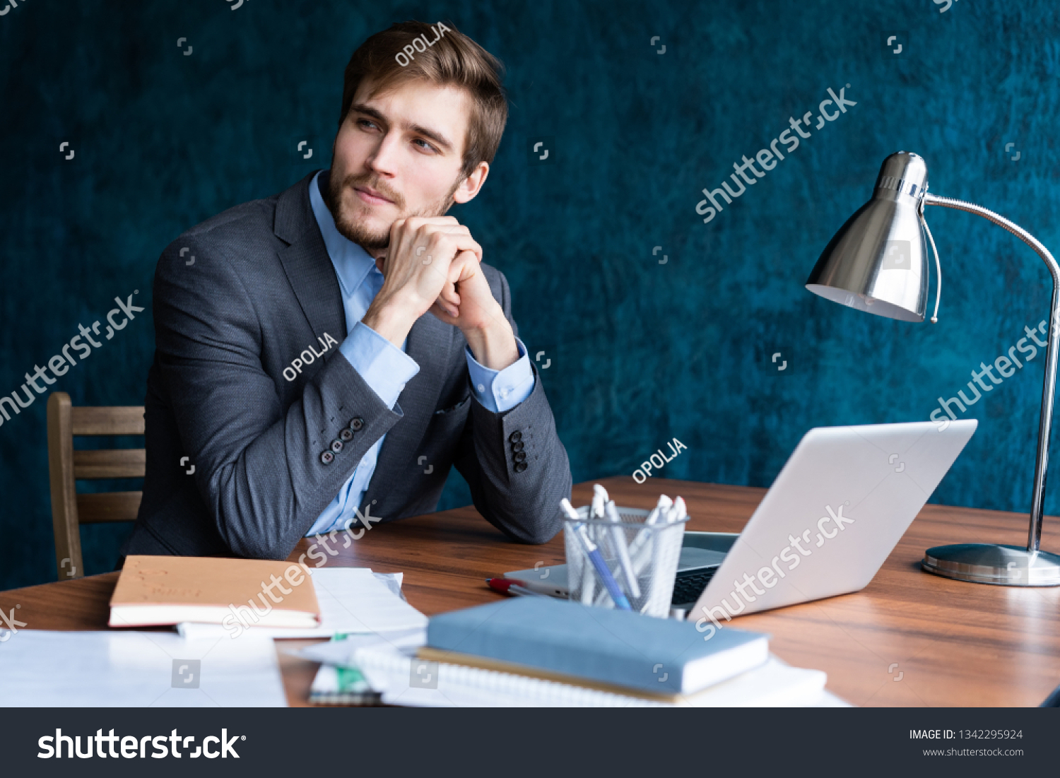 Shot Young Man Sitting Table Looking Stock Photo 1342295924 | Shutterstock