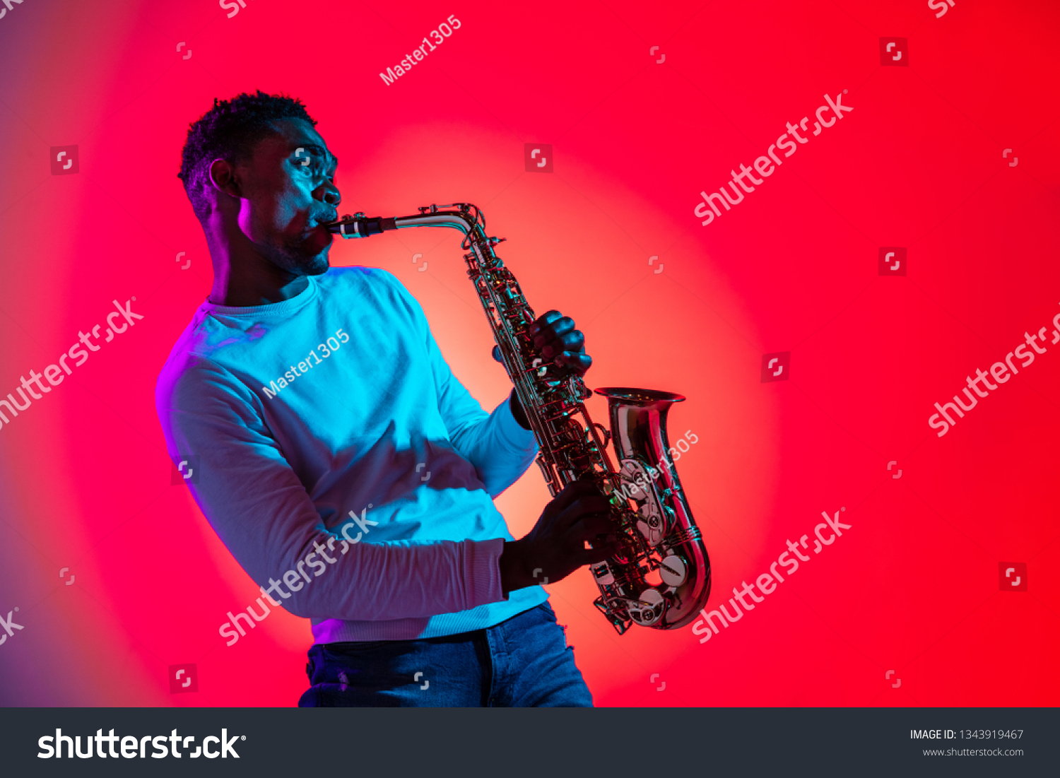 african-american-handsome-jazz-musician-playing-stock-photo-1343919467