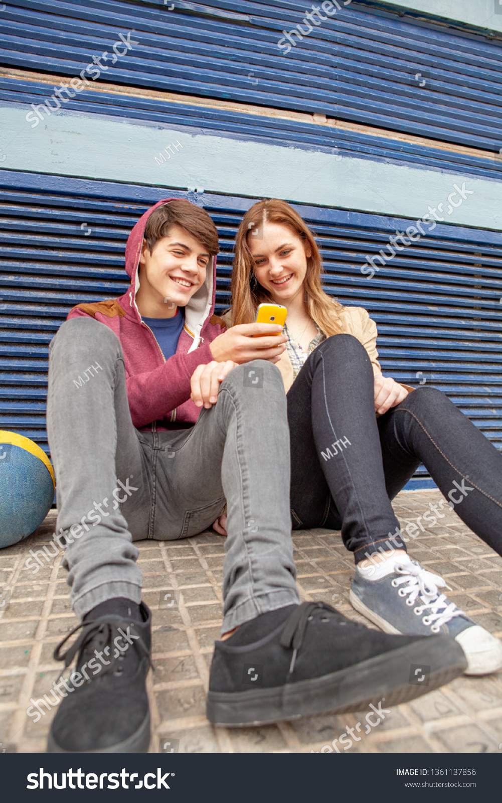 Male Female Teenager Friends Sitting Together Stock Photo 1361137856 ...