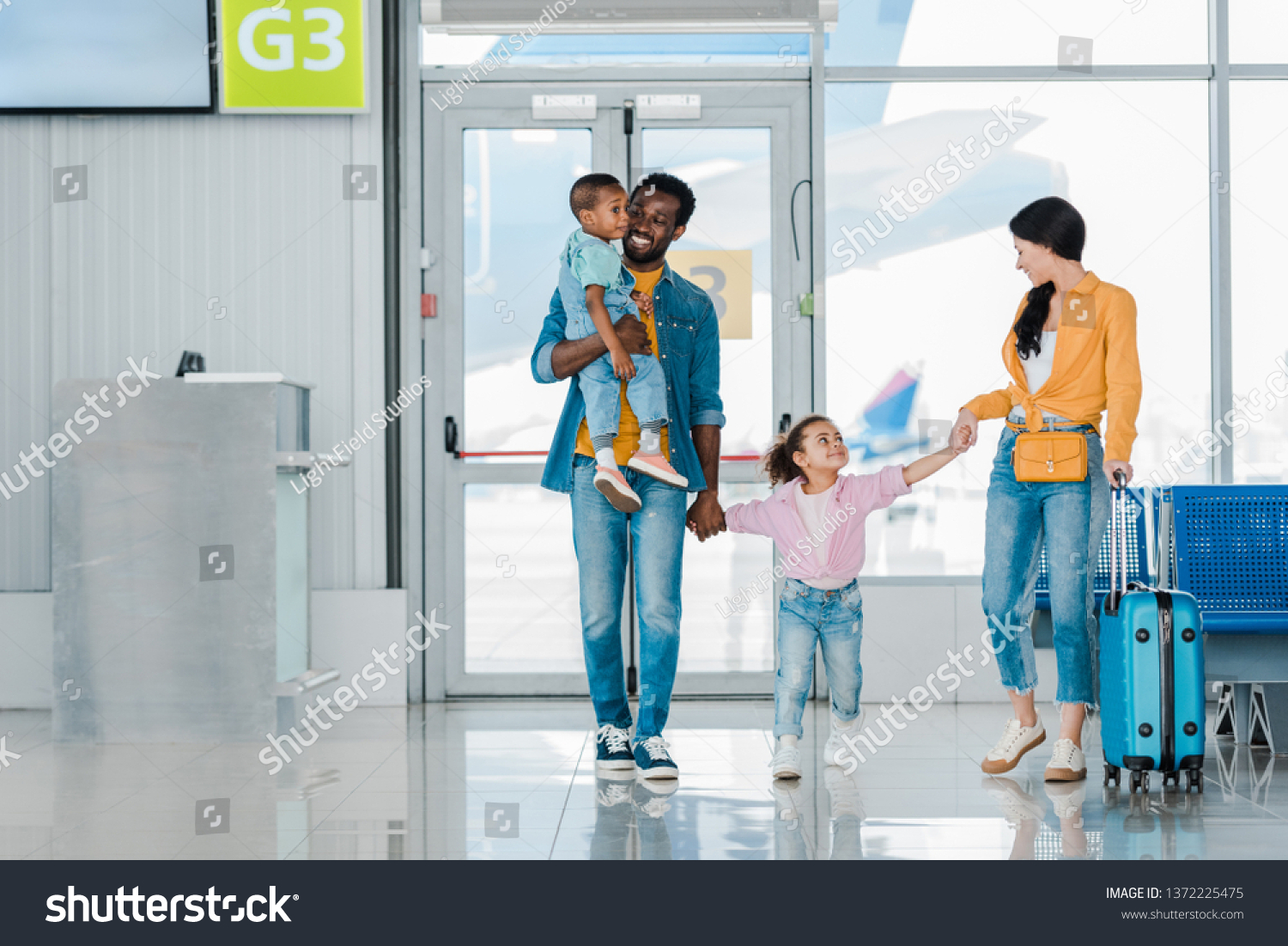 Waiting hall. Family in Airport. Афро семья в аэропорту. Family Travel Airport. Flying with Family Airport.