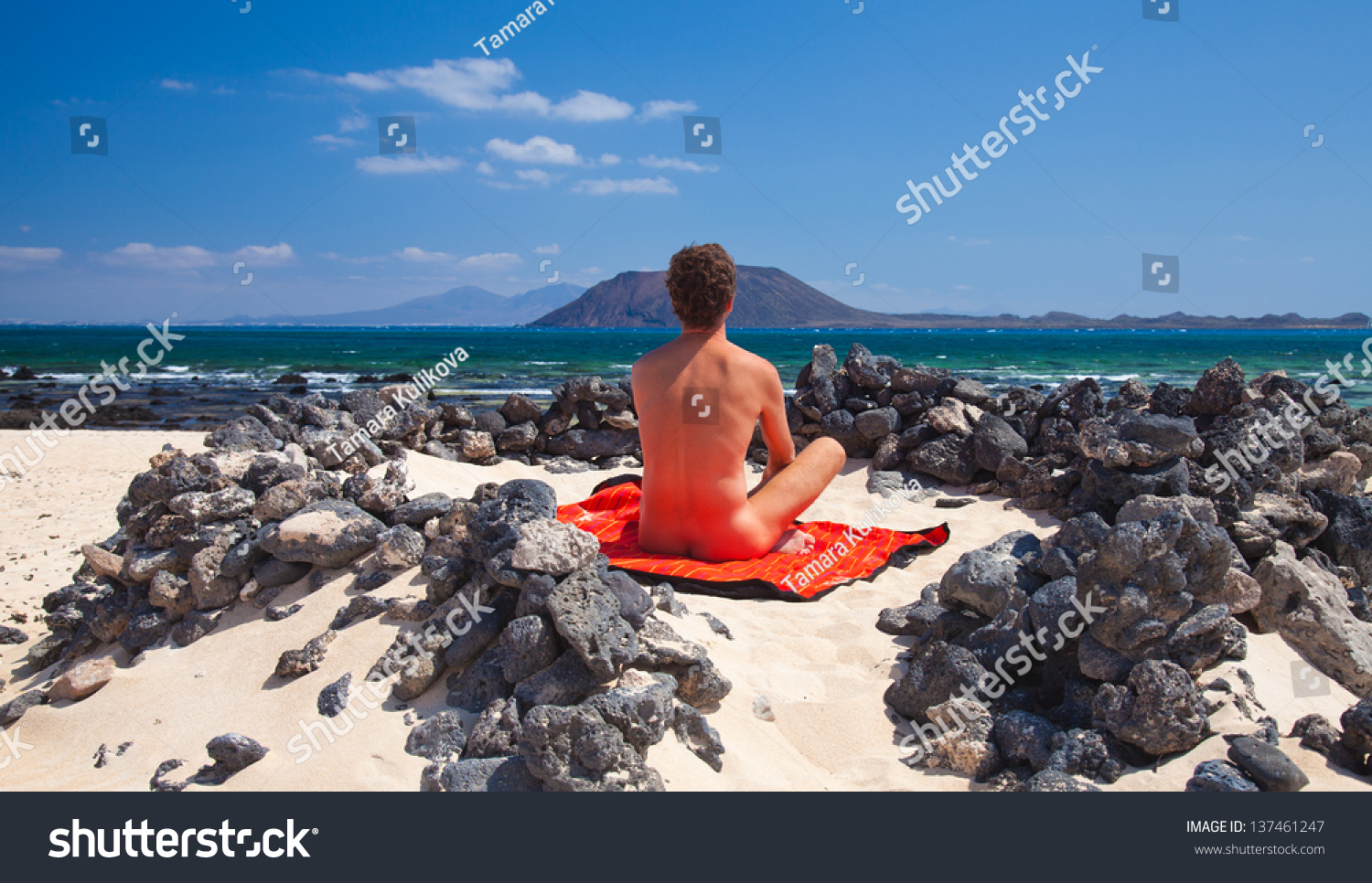 Стоковая фотография 137461247: Male Naturist On Fuerteventura Corralejo Bea...