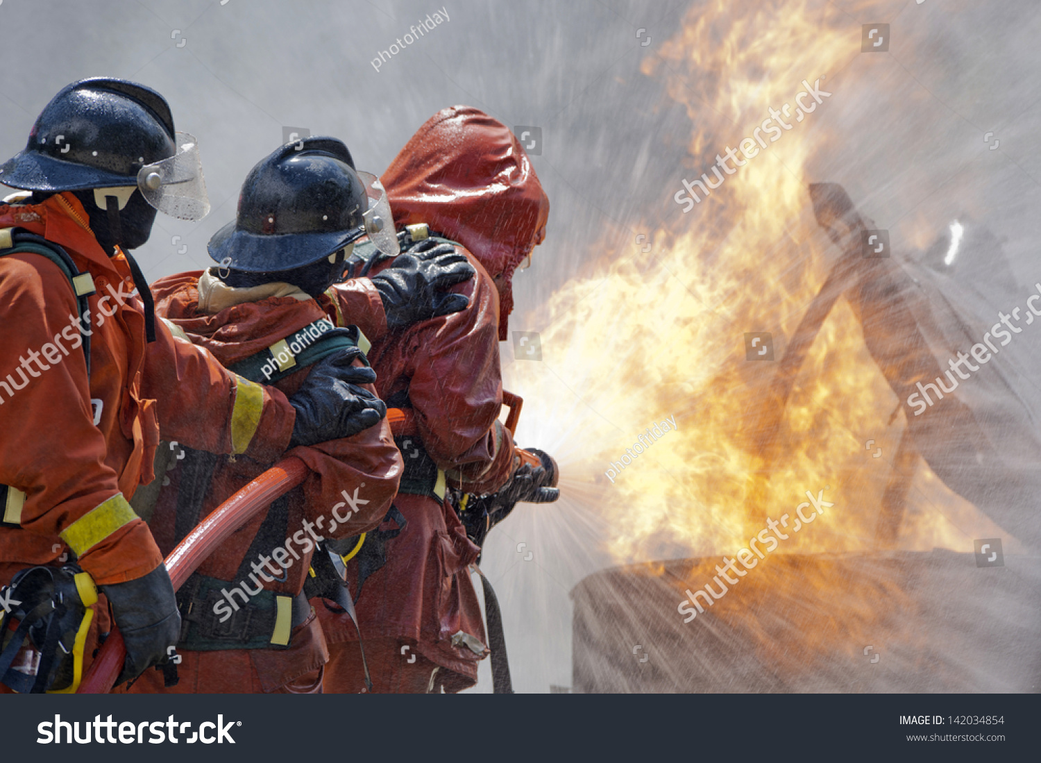 Firefighter Fighting Fire During Training Exercise Stock Photo ...