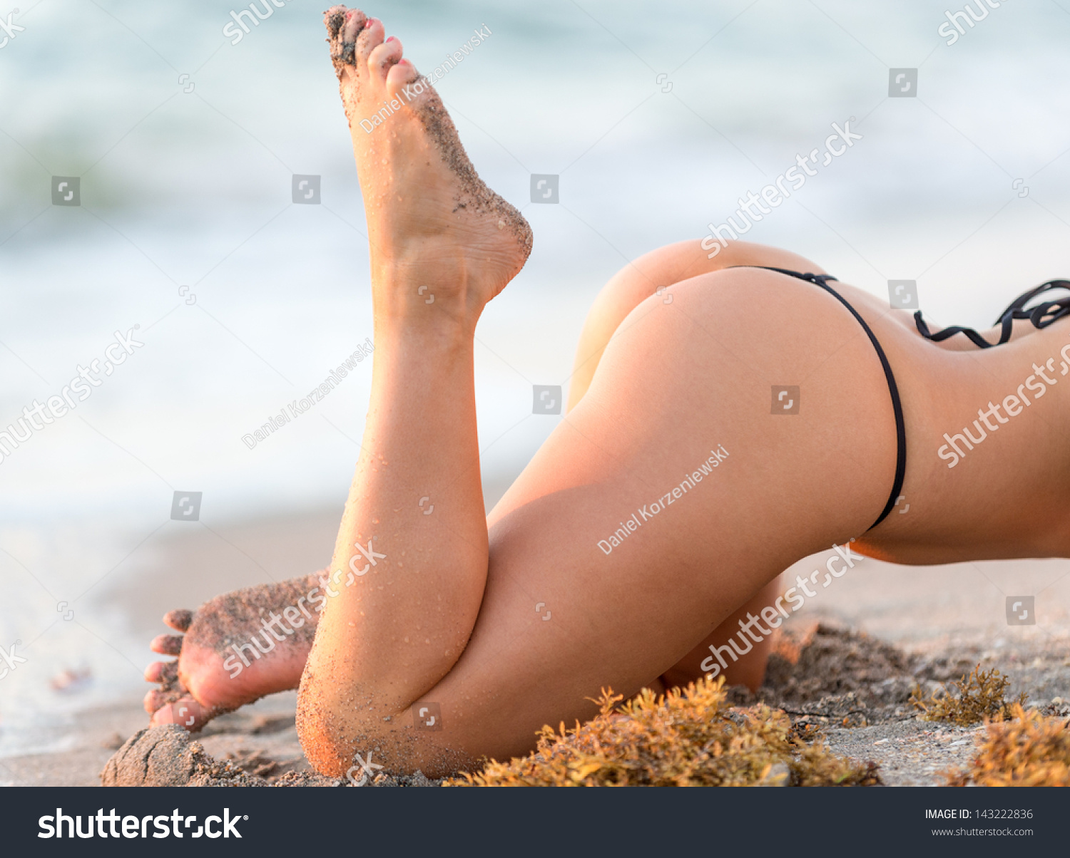 Womans Beautiful Butt Legs On Beach