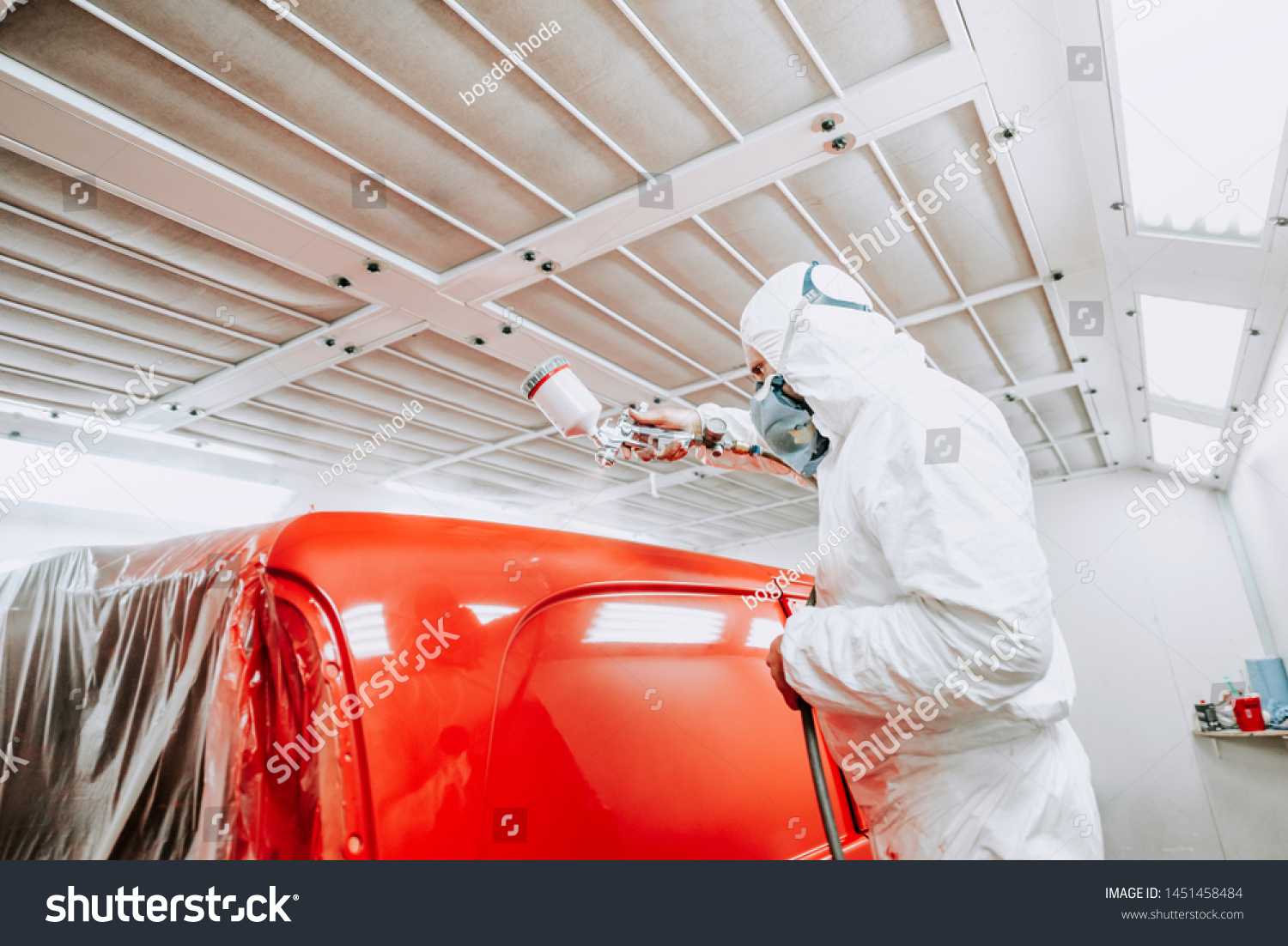 Auto Mechanic Painter Painting Red Car Stock Photo 1451458484   Stock Photo Auto Mechanic Painter Painting A Red Car A Van In Special Booth 1451458484 