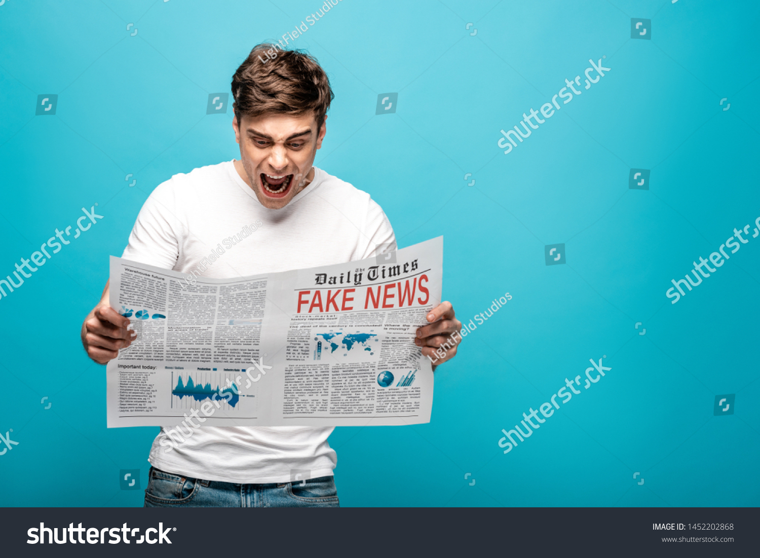 Angry Man Yelling While Reading Newspaper Stock Photo 1452202868 ...