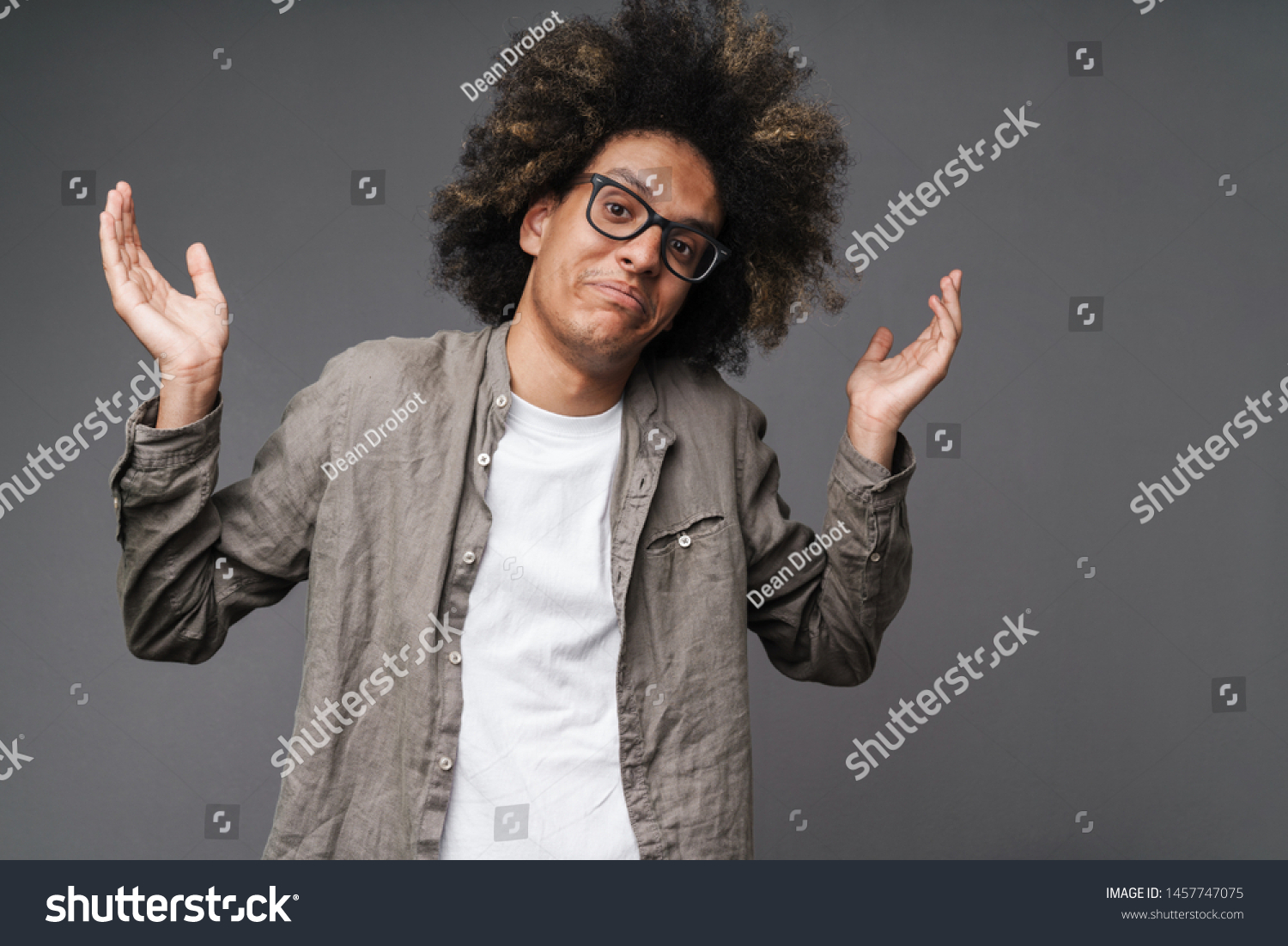 Photo Confused Young Man Afro Hairstyle Stock Photo 1457747075 ...