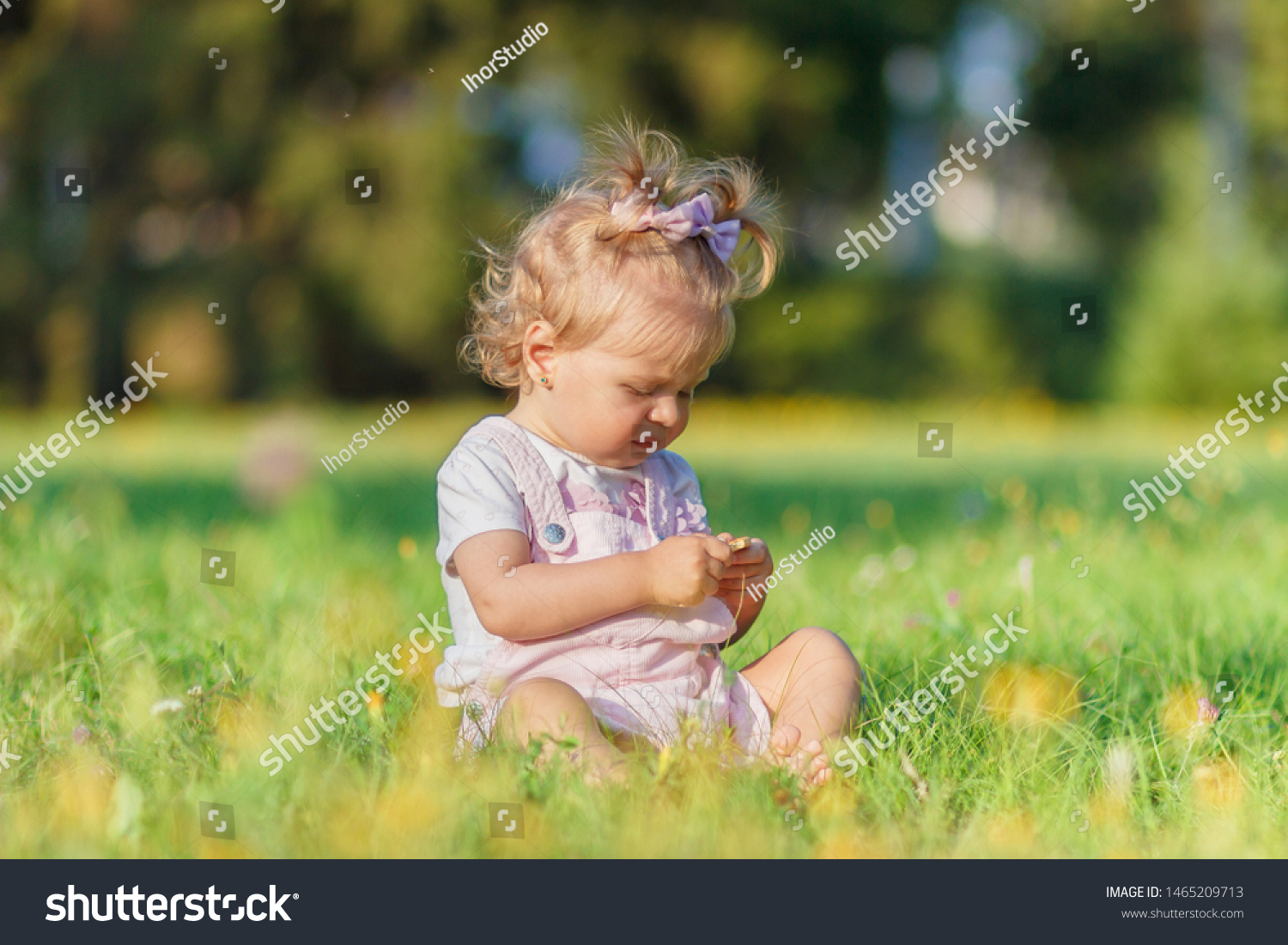 Cute Little Girl Sits On Green Stock Photo 1443611042 | Shutterstock