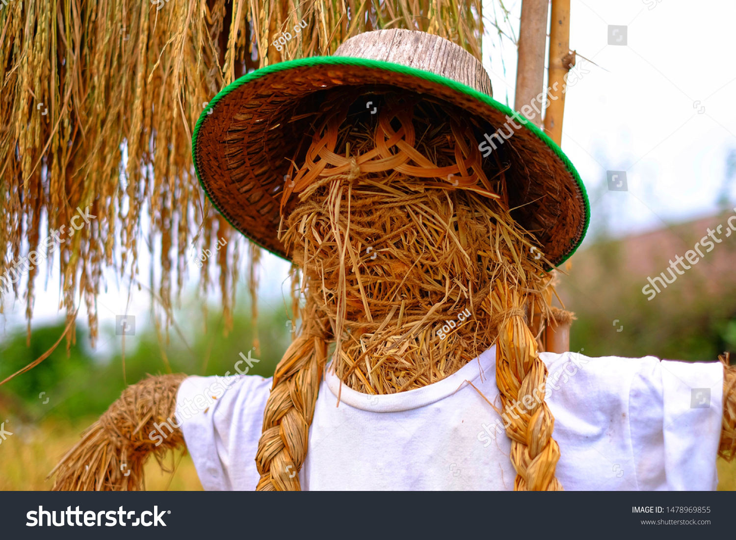 scarecrow with straw hat