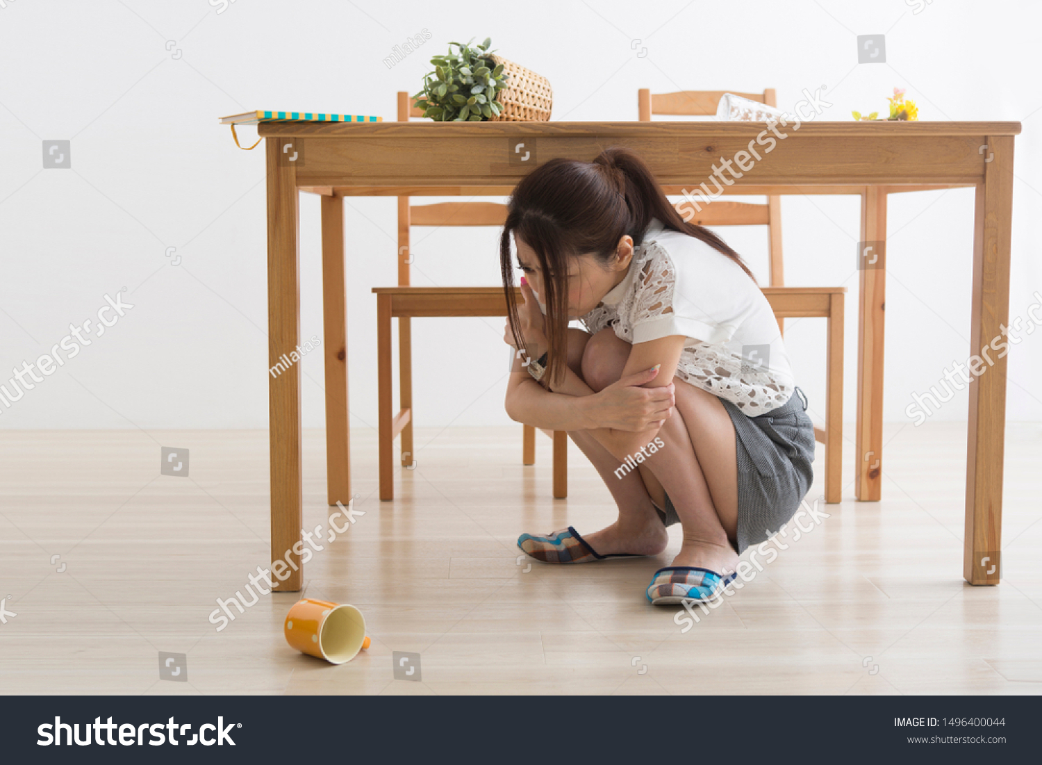 Woman Evacuating Under Table Earthquake Stock Photo Shutterstock