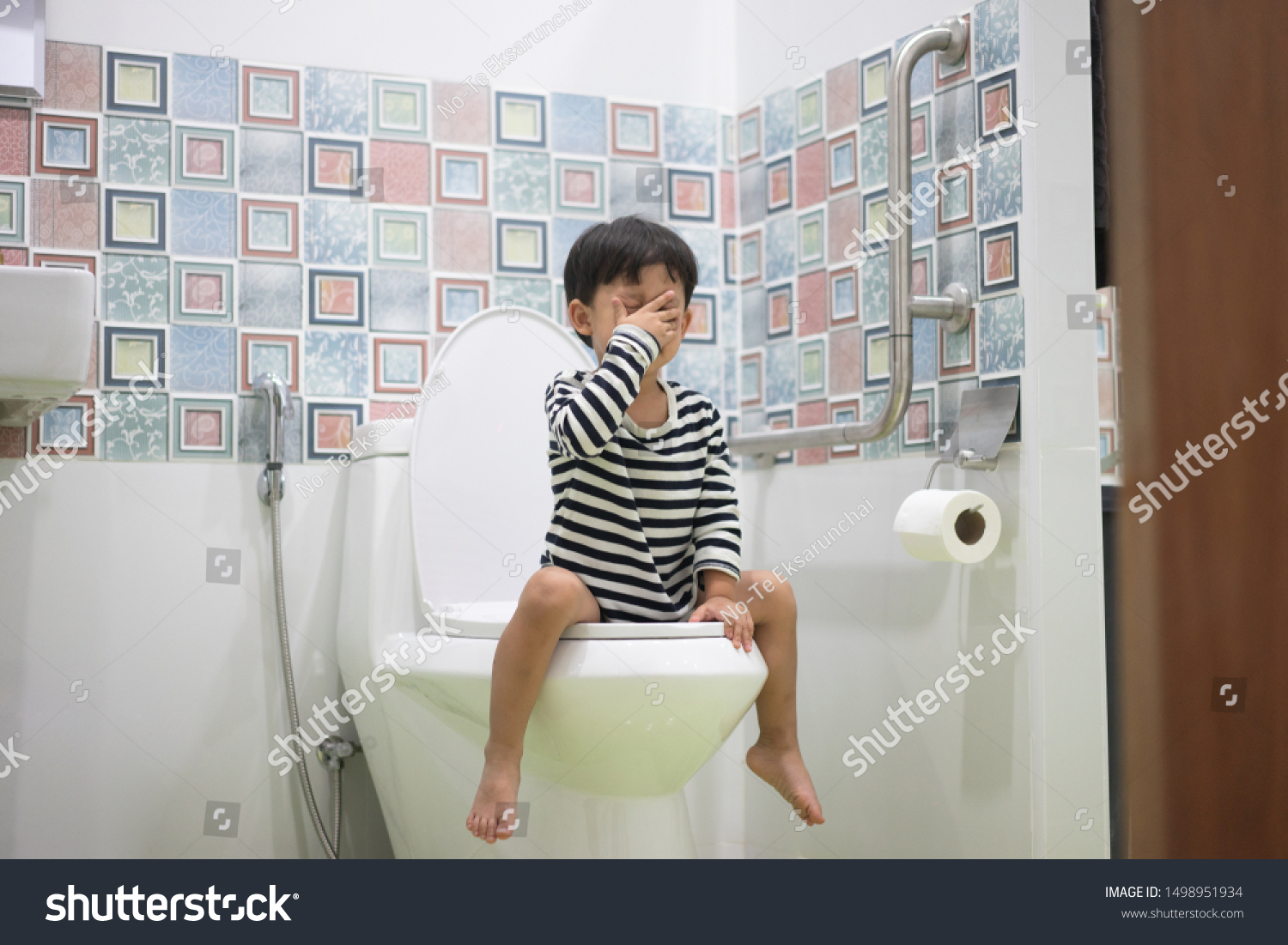 Boy Sitting On Toilet Suffering Constipation Stock Photo 1498951934 ...