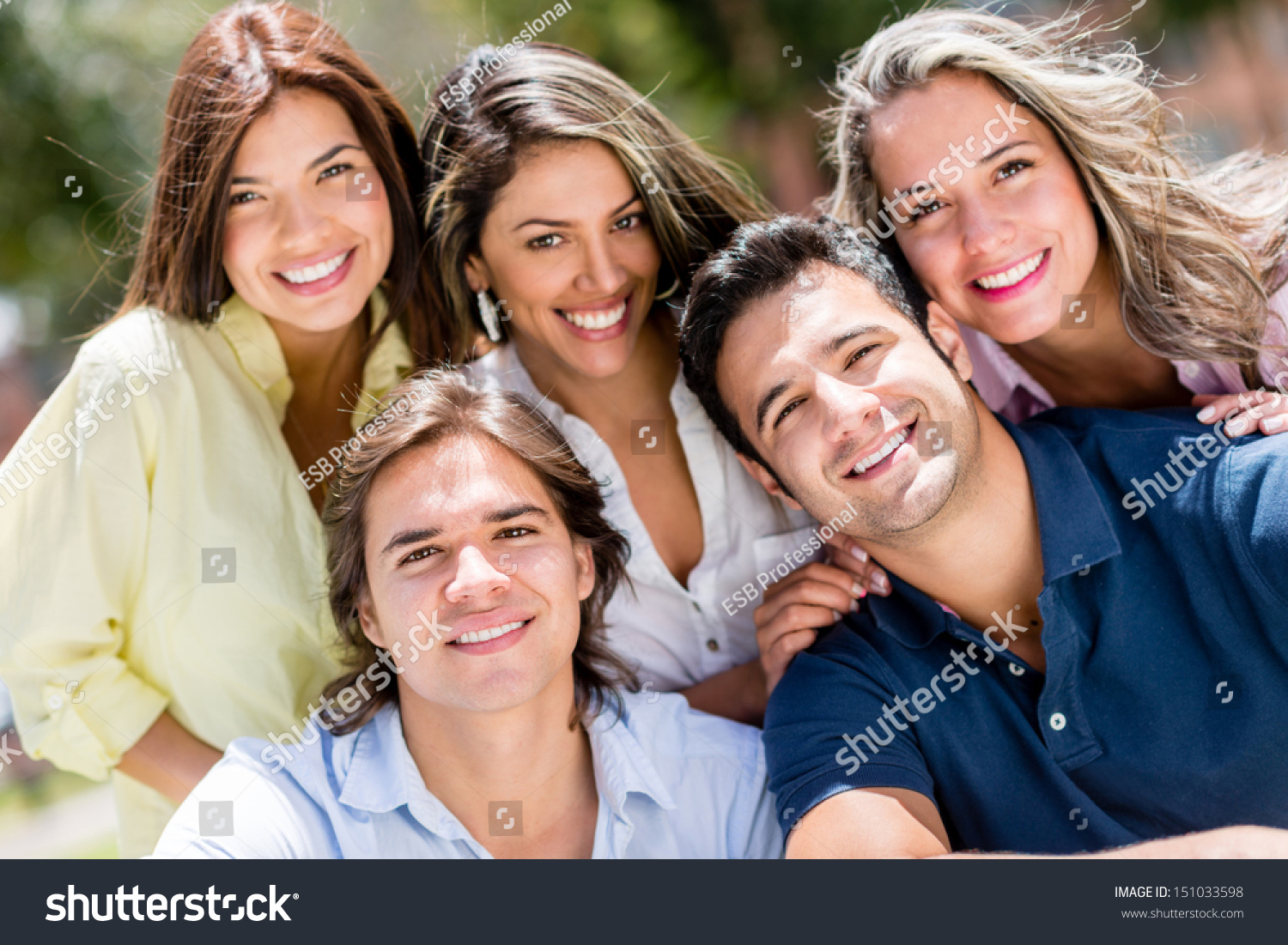 group of people smiling outside