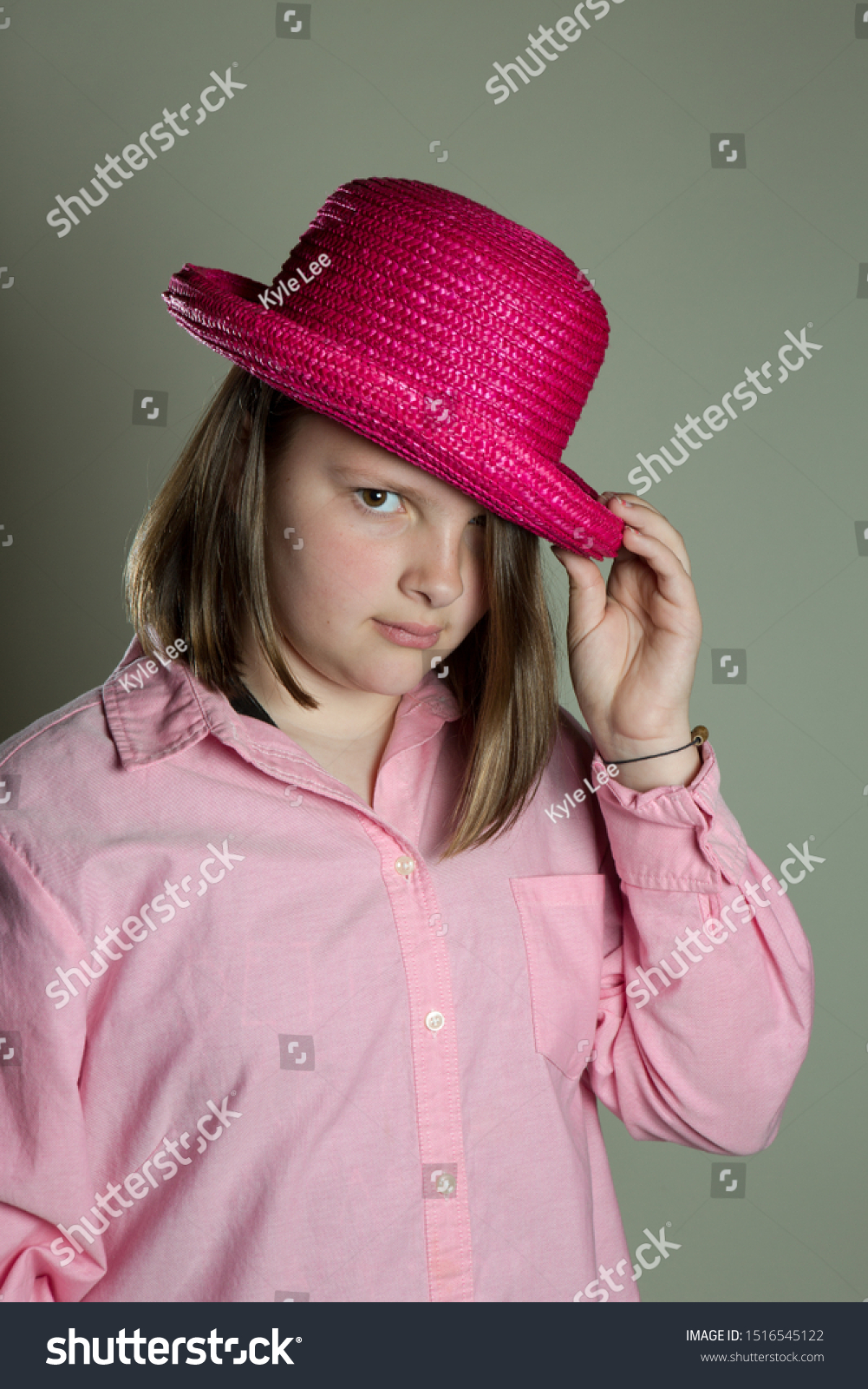 eleven-year-old-girl-oversized-pink-stock-photo-1516545122-shutterstock