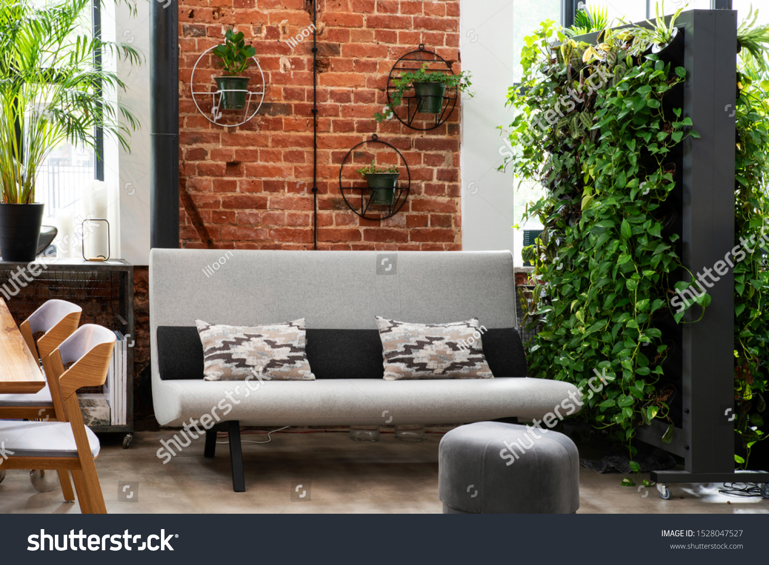 Stock Photo Modern Interior Of Living Room With Red Bricky Wall And Green Vertical Garden In Loft Apartment 1528047527 