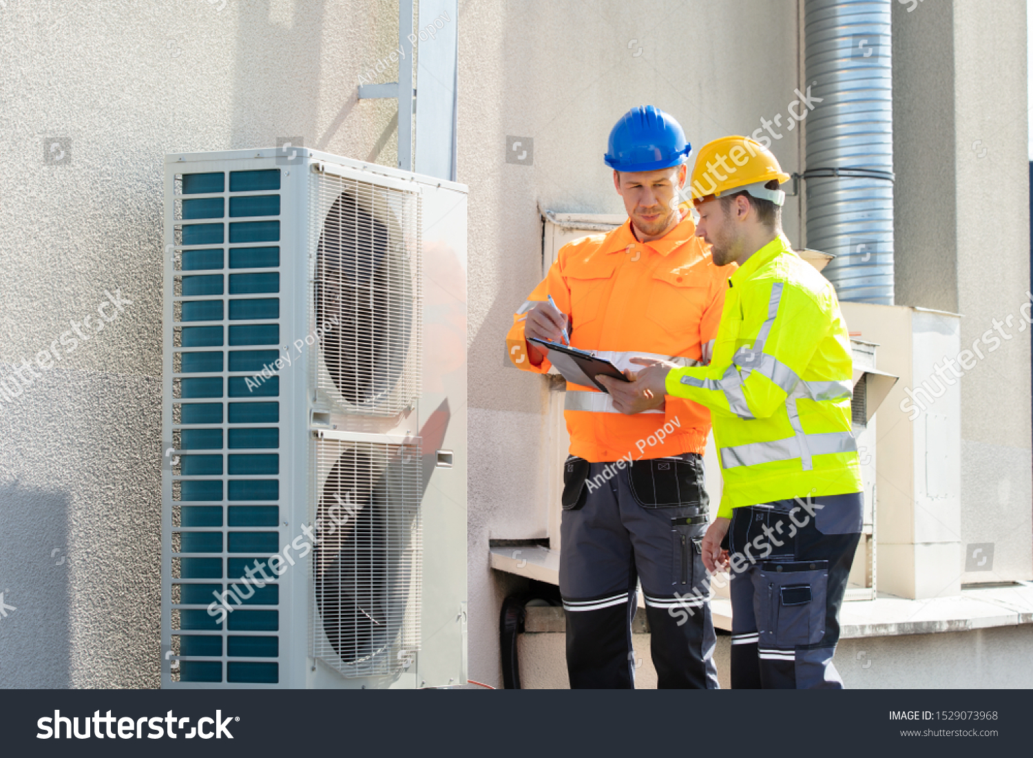 Two Electricians Men Wearing Safety Jackets Stock Photo 1529073968 ...